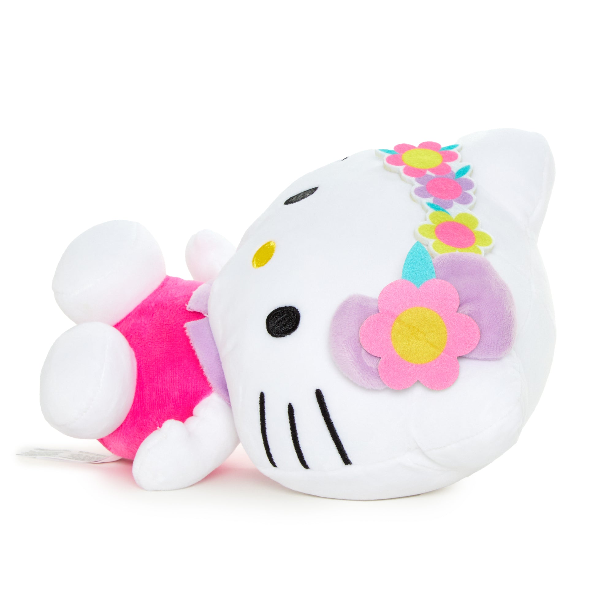 Hello Kitty plush doll with flower crown, side view.