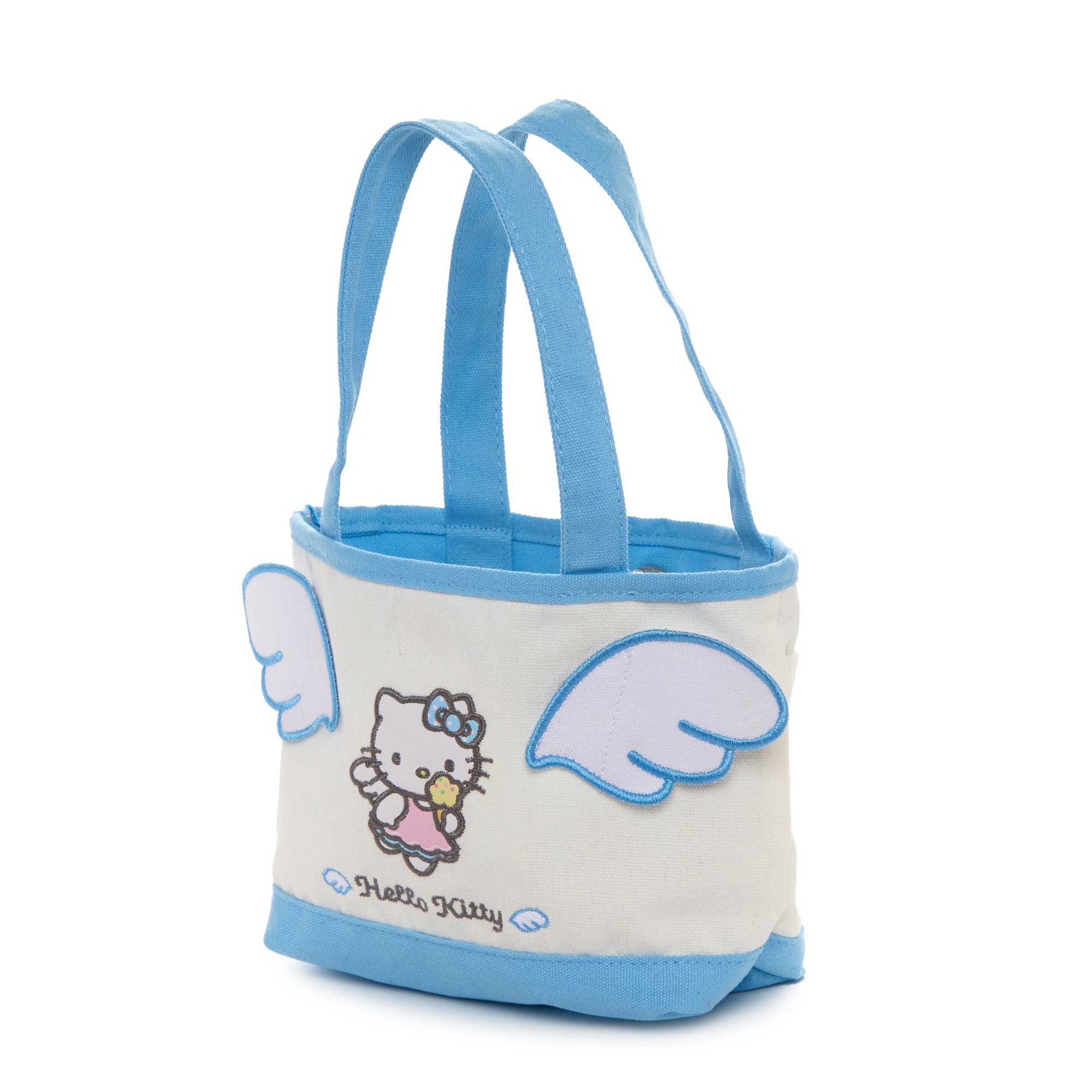 Front view of Hello Kitty Ice Cream Dream mini canvas tote on a picnic blanket