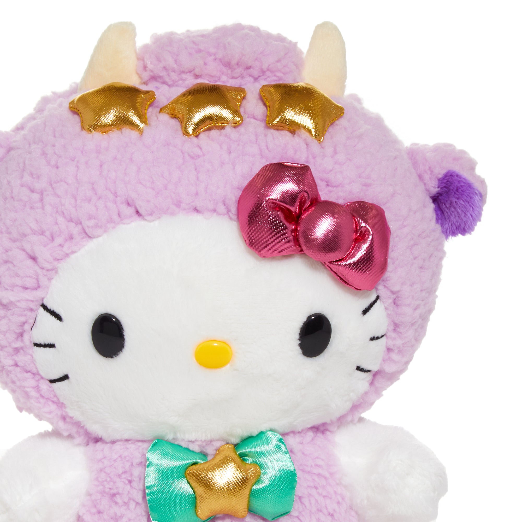 Hello Kitty Taurus plush sitting on a shelf with stars in the background