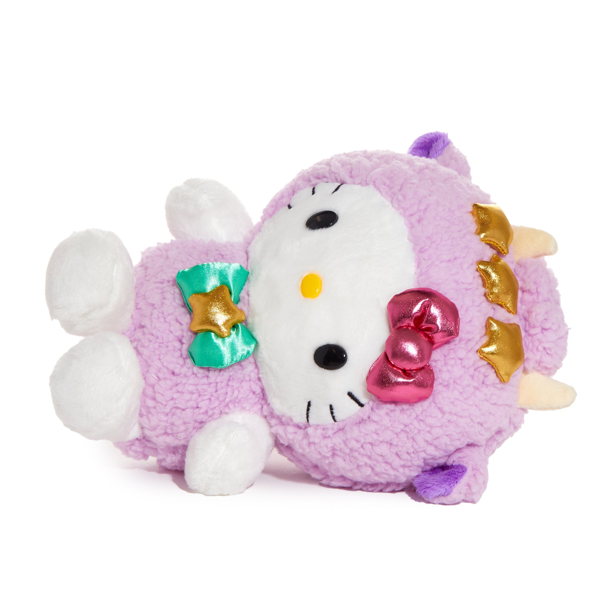 Hello Kitty Taurus plush sitting on a shelf with stars in the background