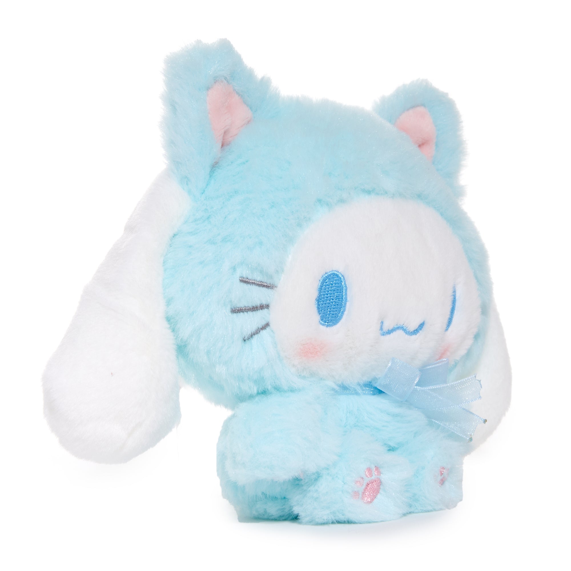 Cinnamoroll plush toy displayed on a soft surface