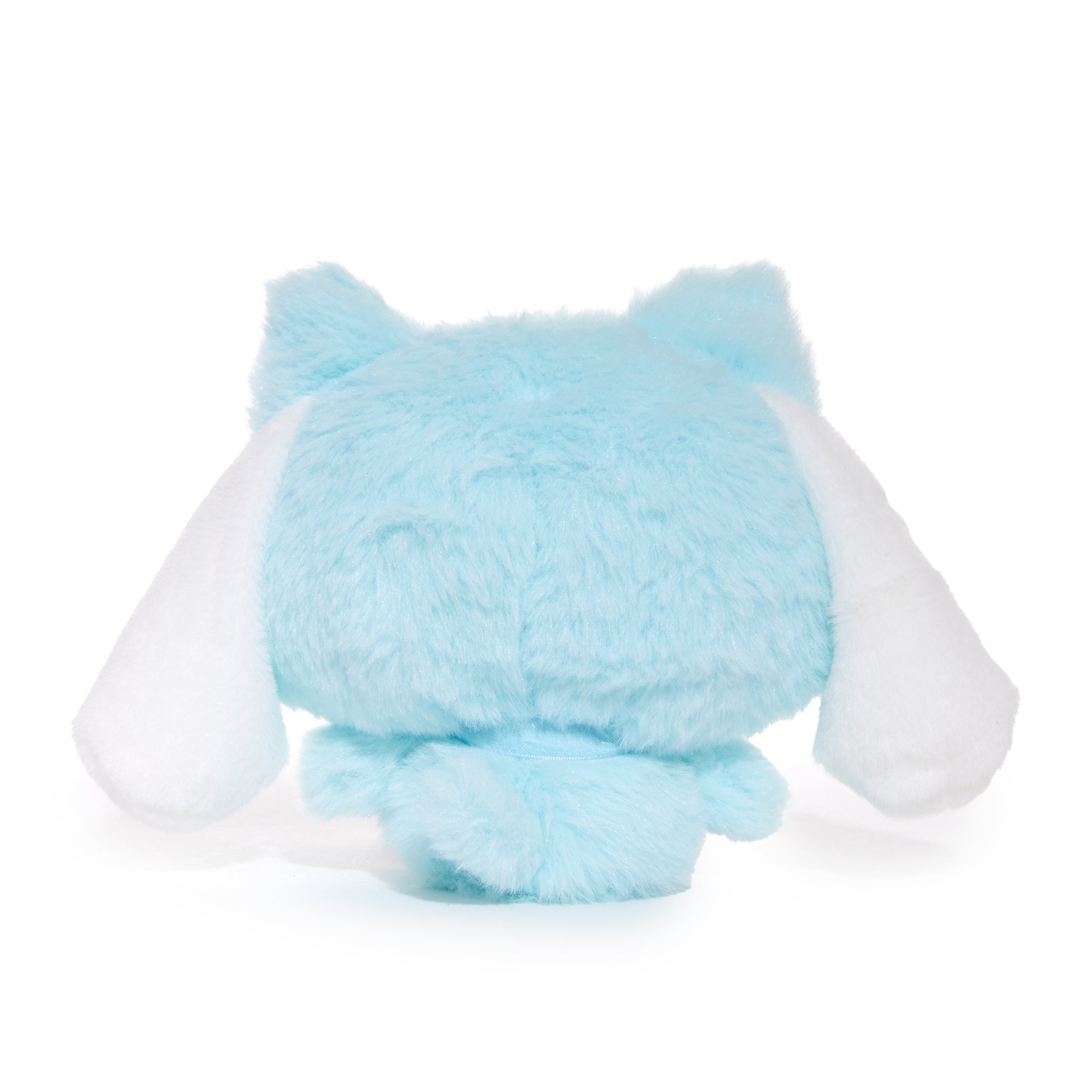 Cinnamoroll plush toy displayed on a soft surface