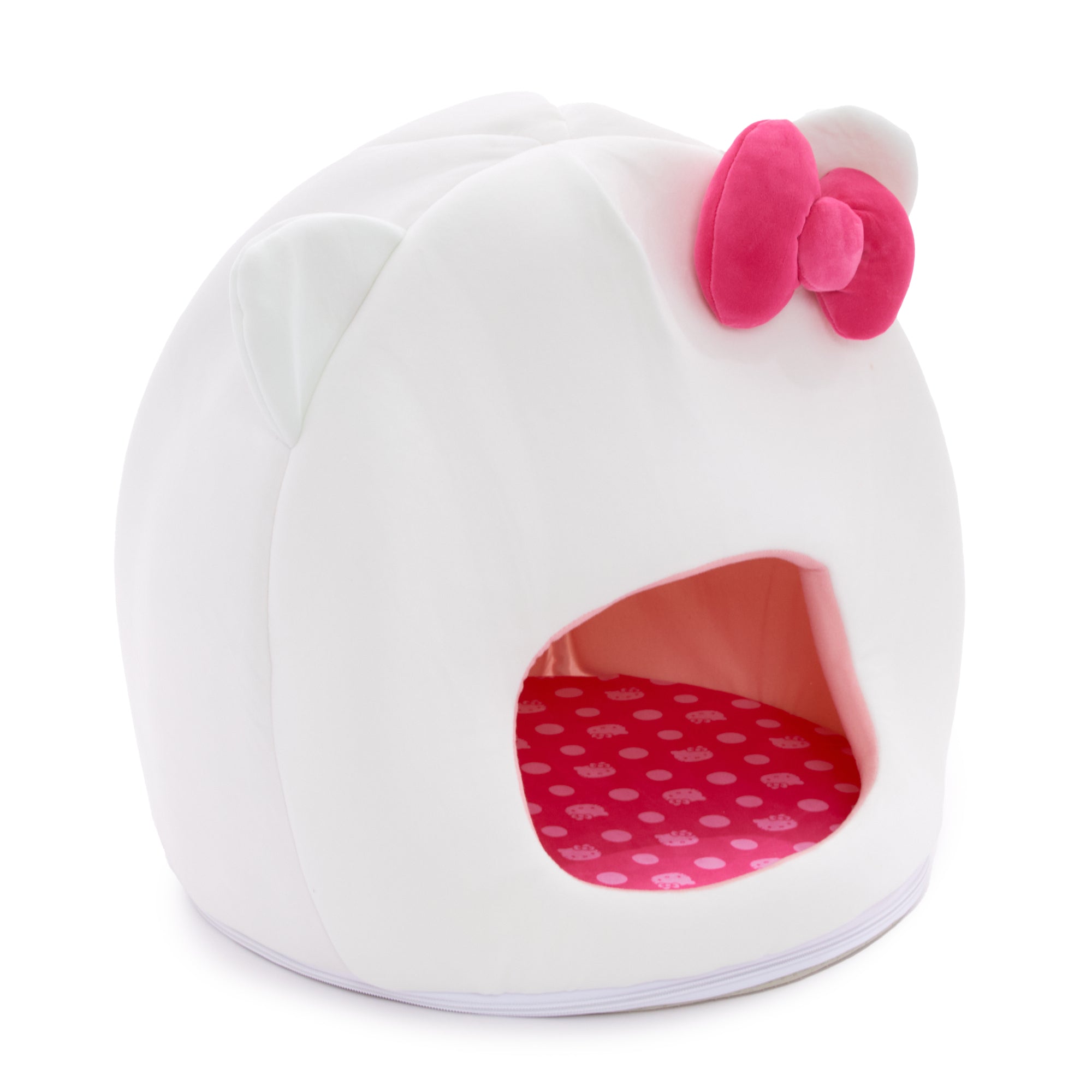 Cozy cat snuggled up inside Hello Kitty covered pet cave bed