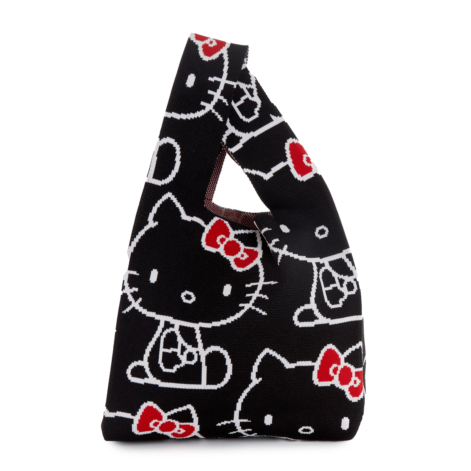 Front view of Hello Kitty knit tote bag against a café backdrop