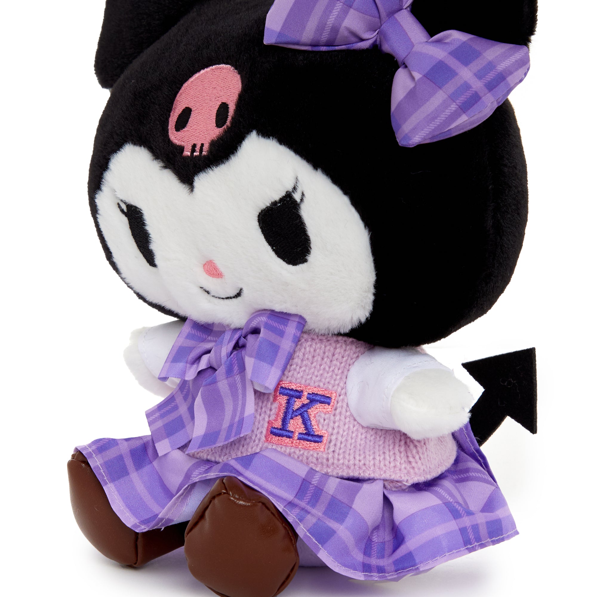 Kuromi plush surrounded by school supplies, perfect for gifting.