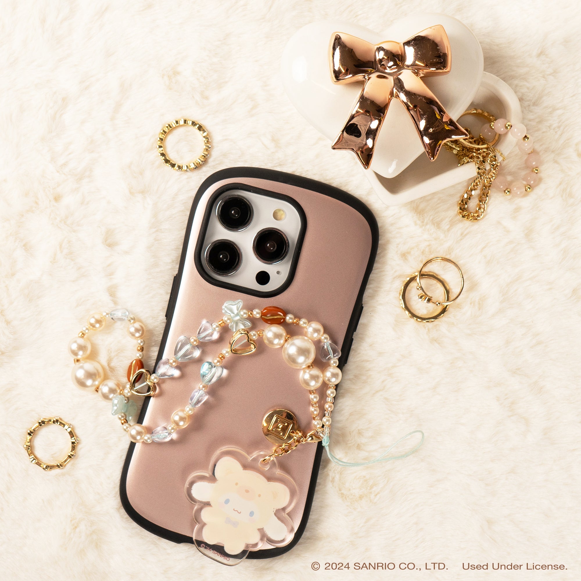 Close-up of the colorful acrylic beads and detachable charms on the phone strap