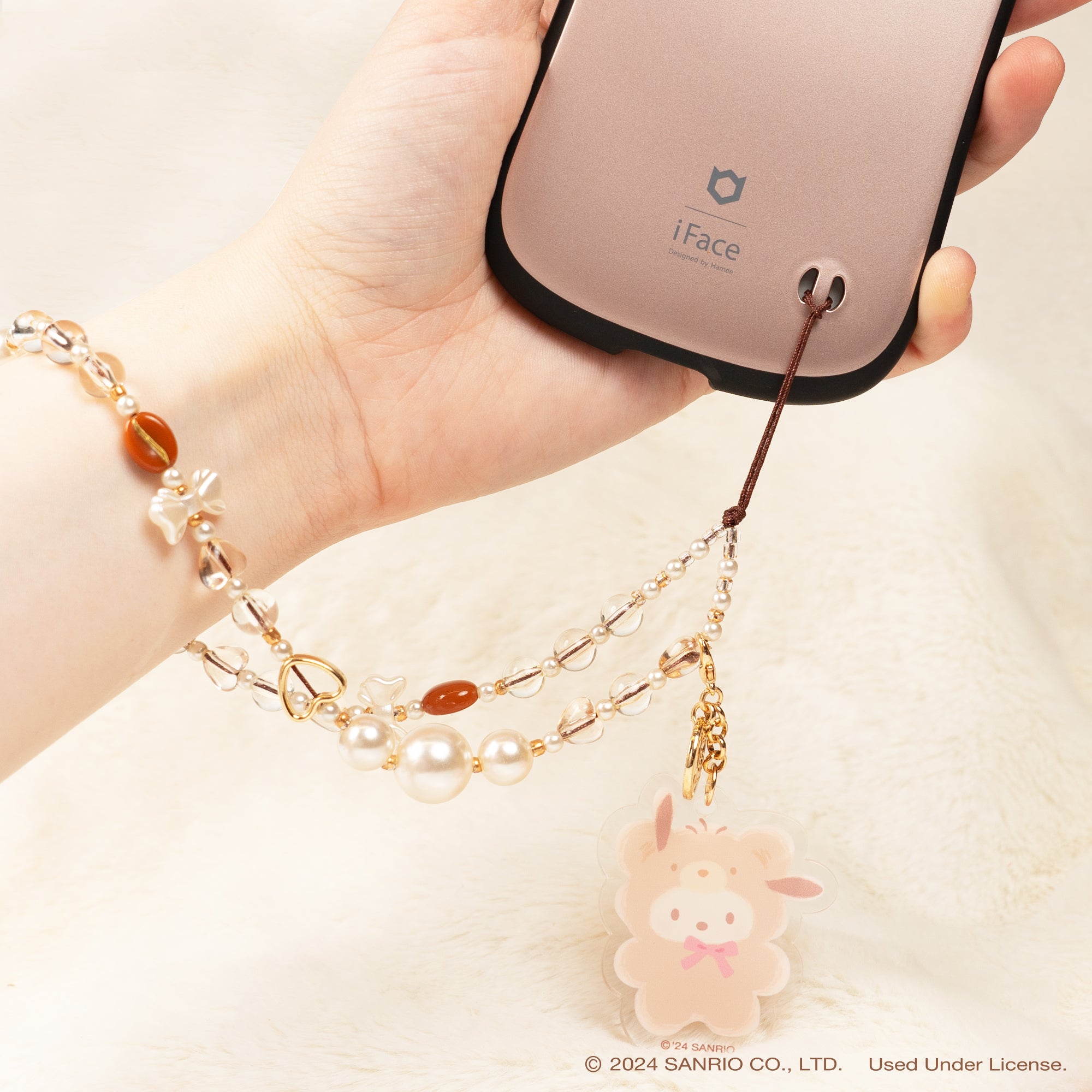 Close-up of the beaded design featuring Hello Kitty and friends