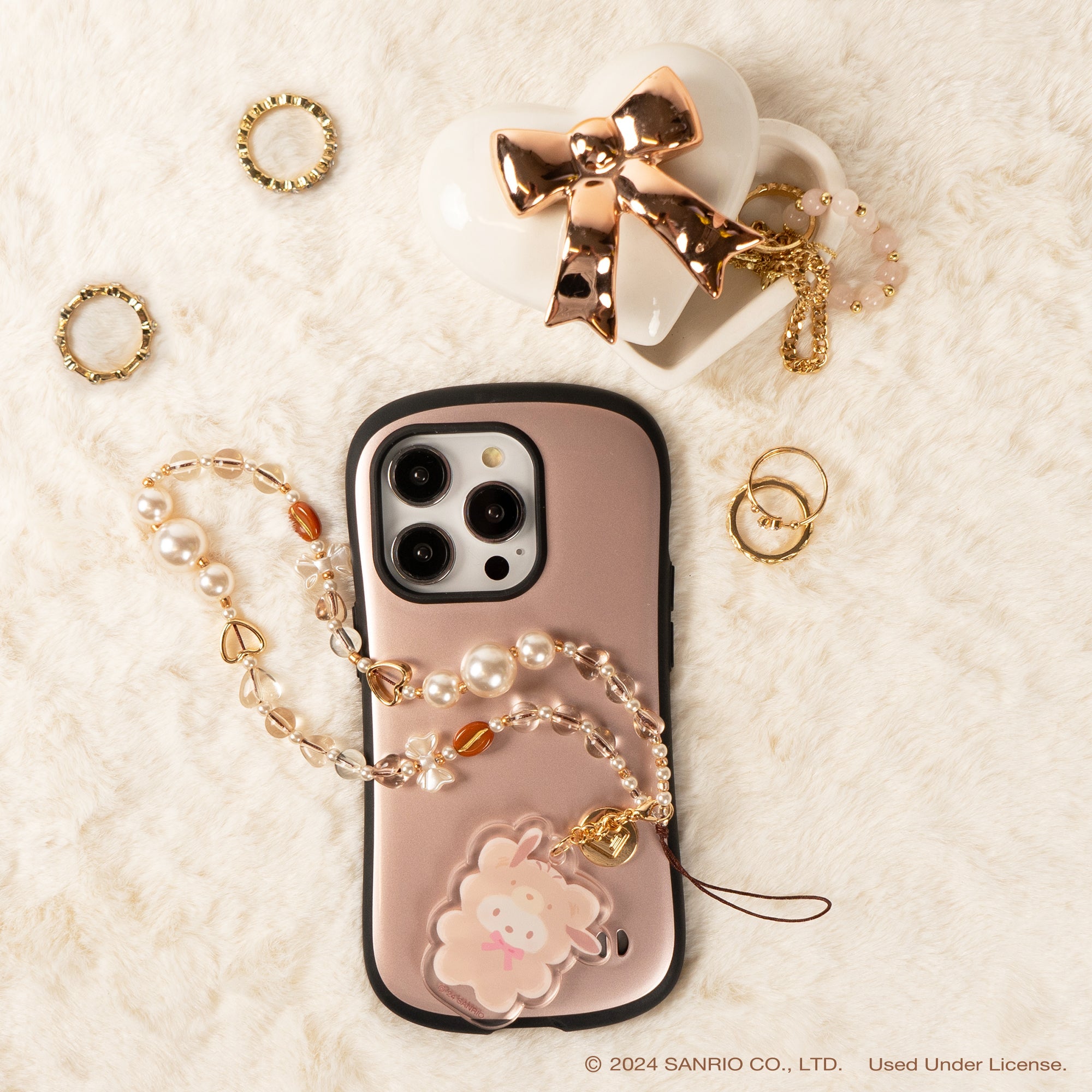 Pochacco Latte Bear beaded phone strap in use at a concert