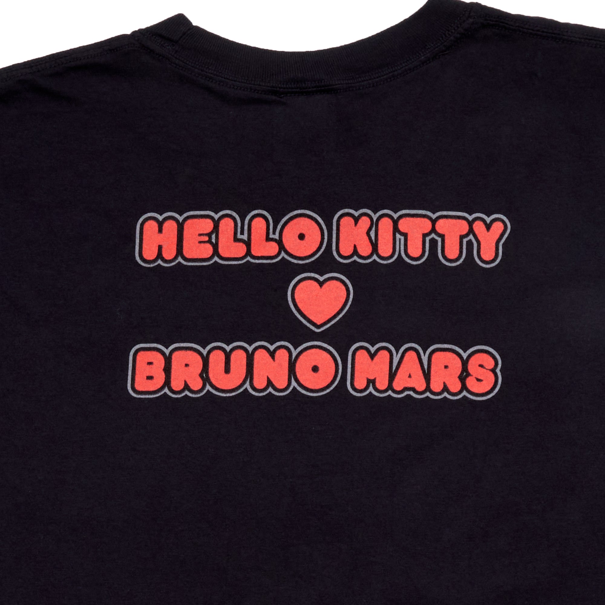 Close-up of the Hello Kitty shirt design with heart hands