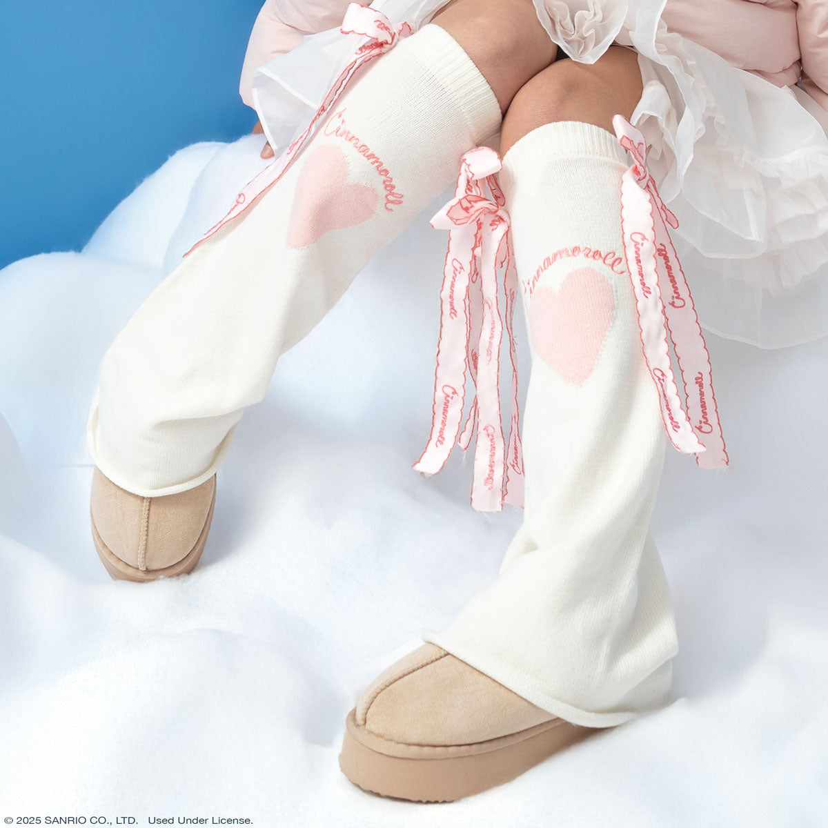 Side view showcasing the pink heart pattern on the leg warmers.