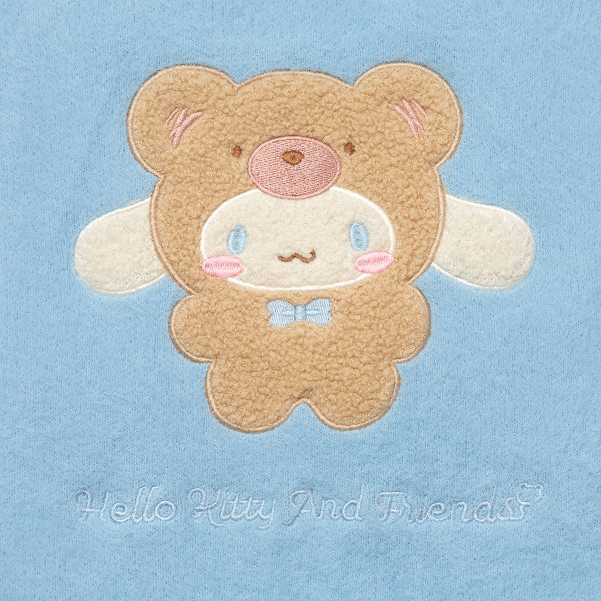 Close-up of Cinnamoroll embroidered on the front pocket of the kawaii cardigan
