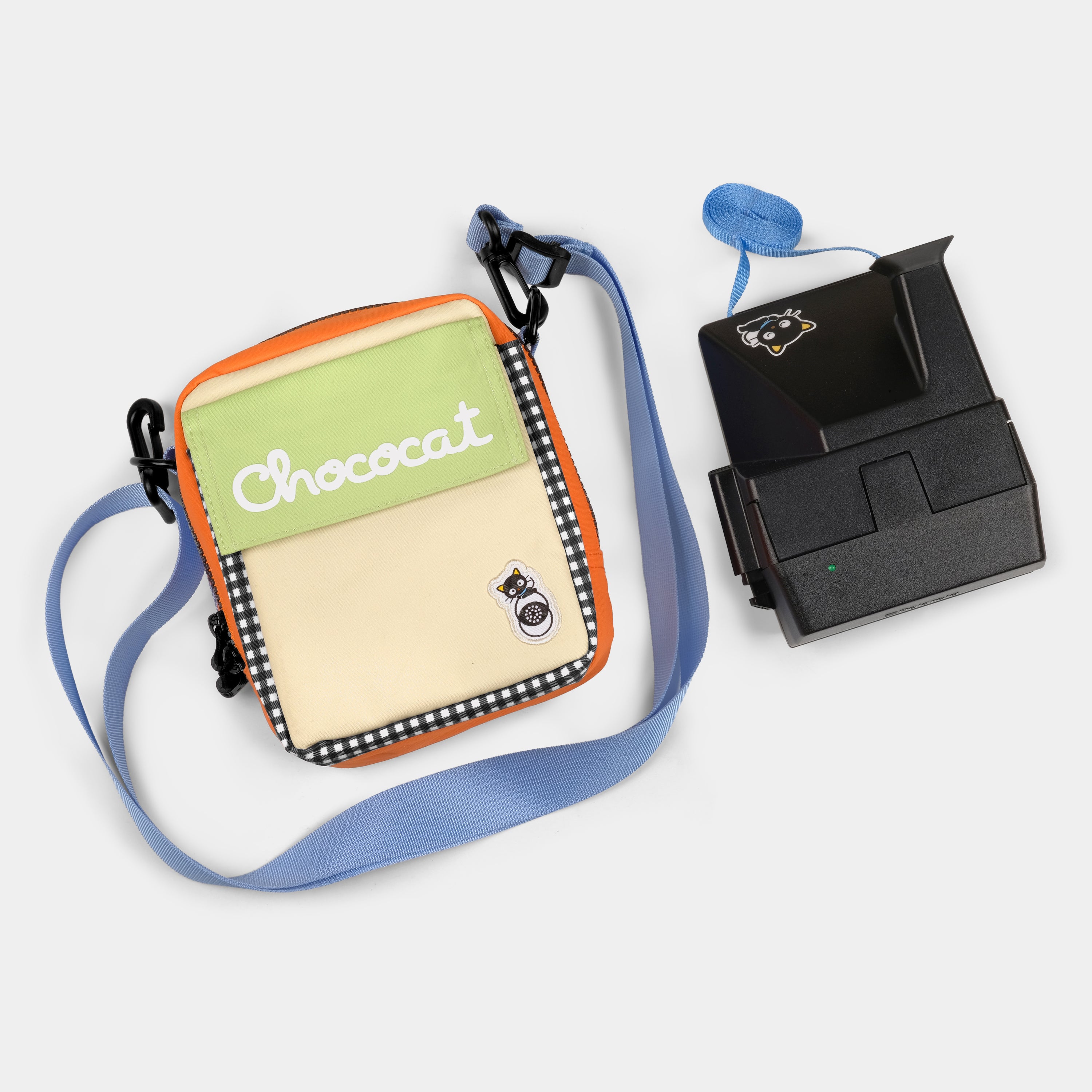 Chococat camera bag with adjustable strap and front pocket for film