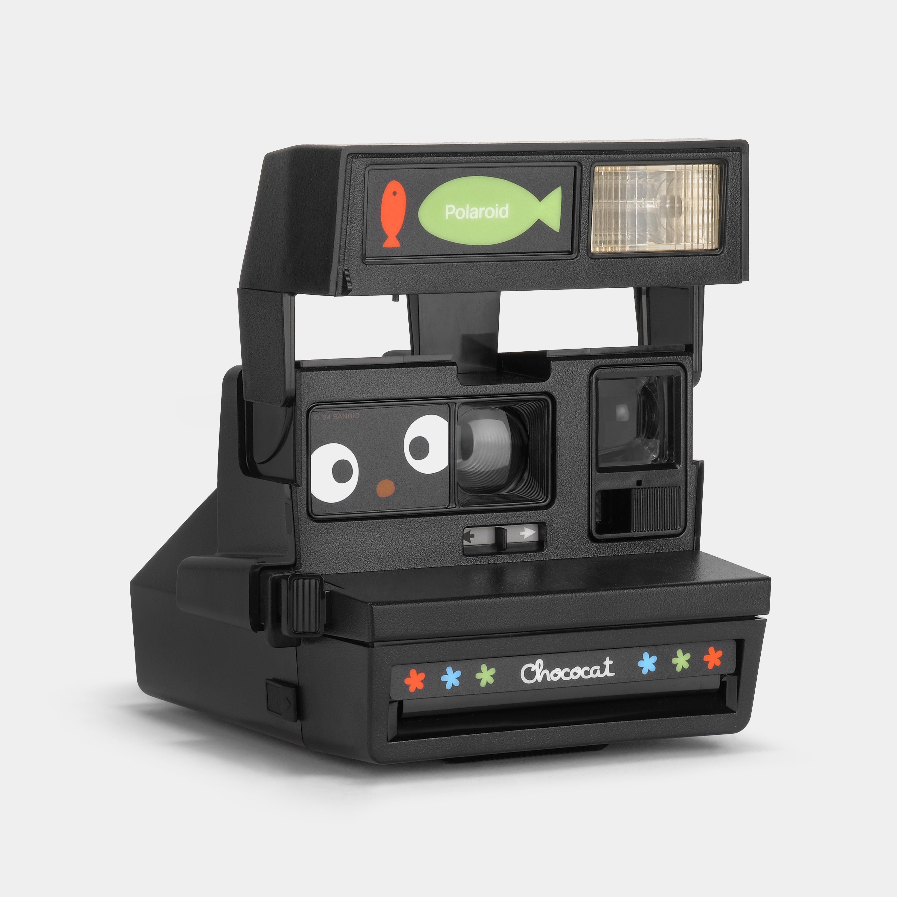 Close-up of the cameras automatic flash feature and colorful exterior