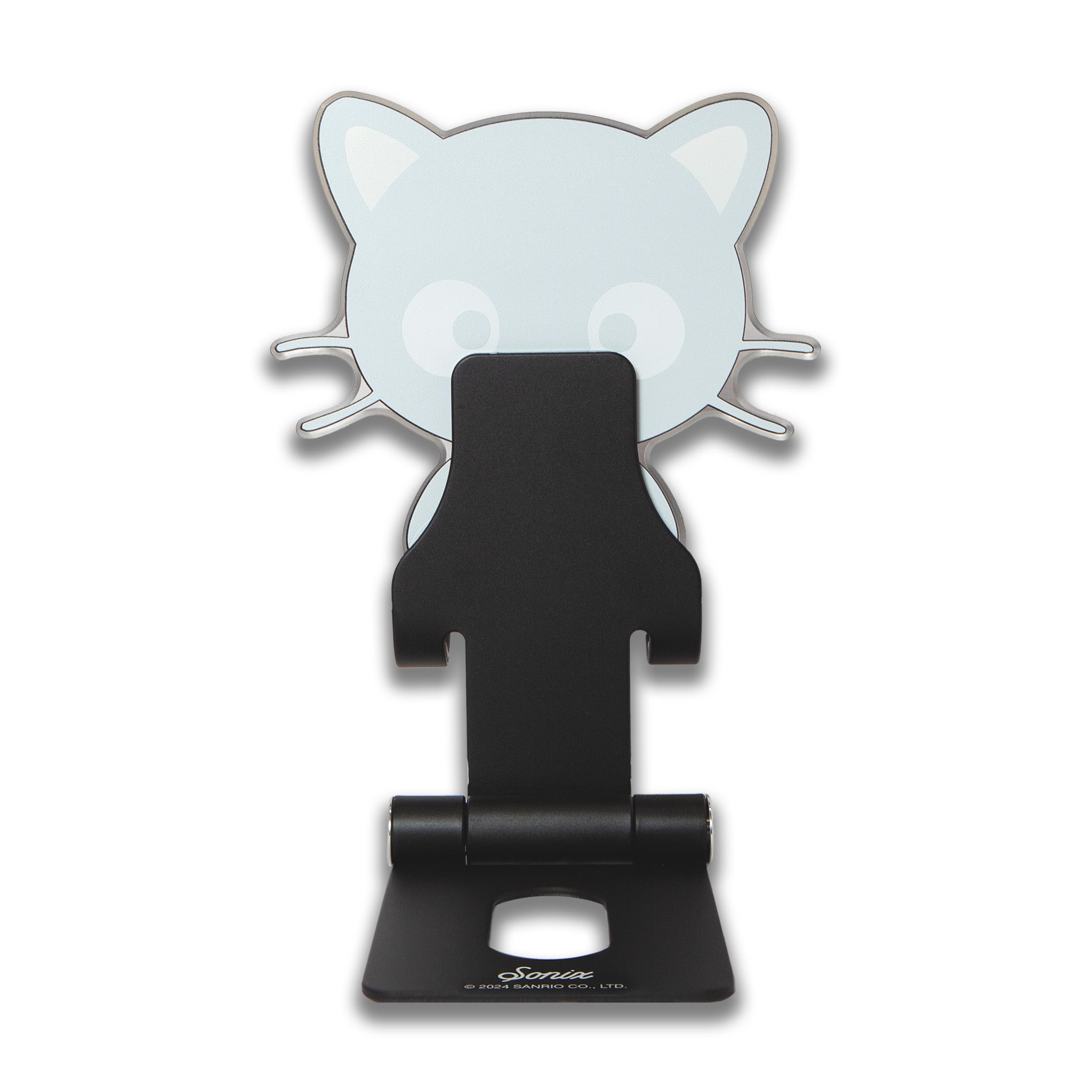 Chococat phone stand on a nightstand, used for watching videos, with a cozy bed in the background