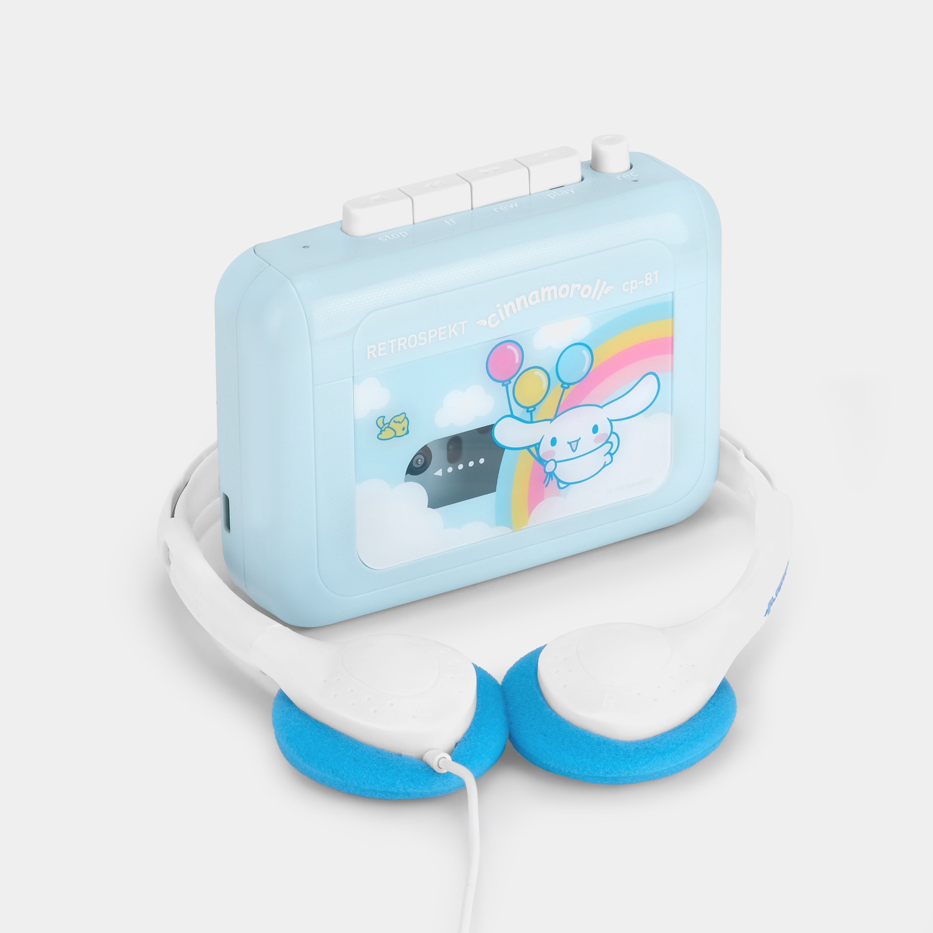 Cinnamoroll CP-81 cassette player in use with retro headphones on a wooden table