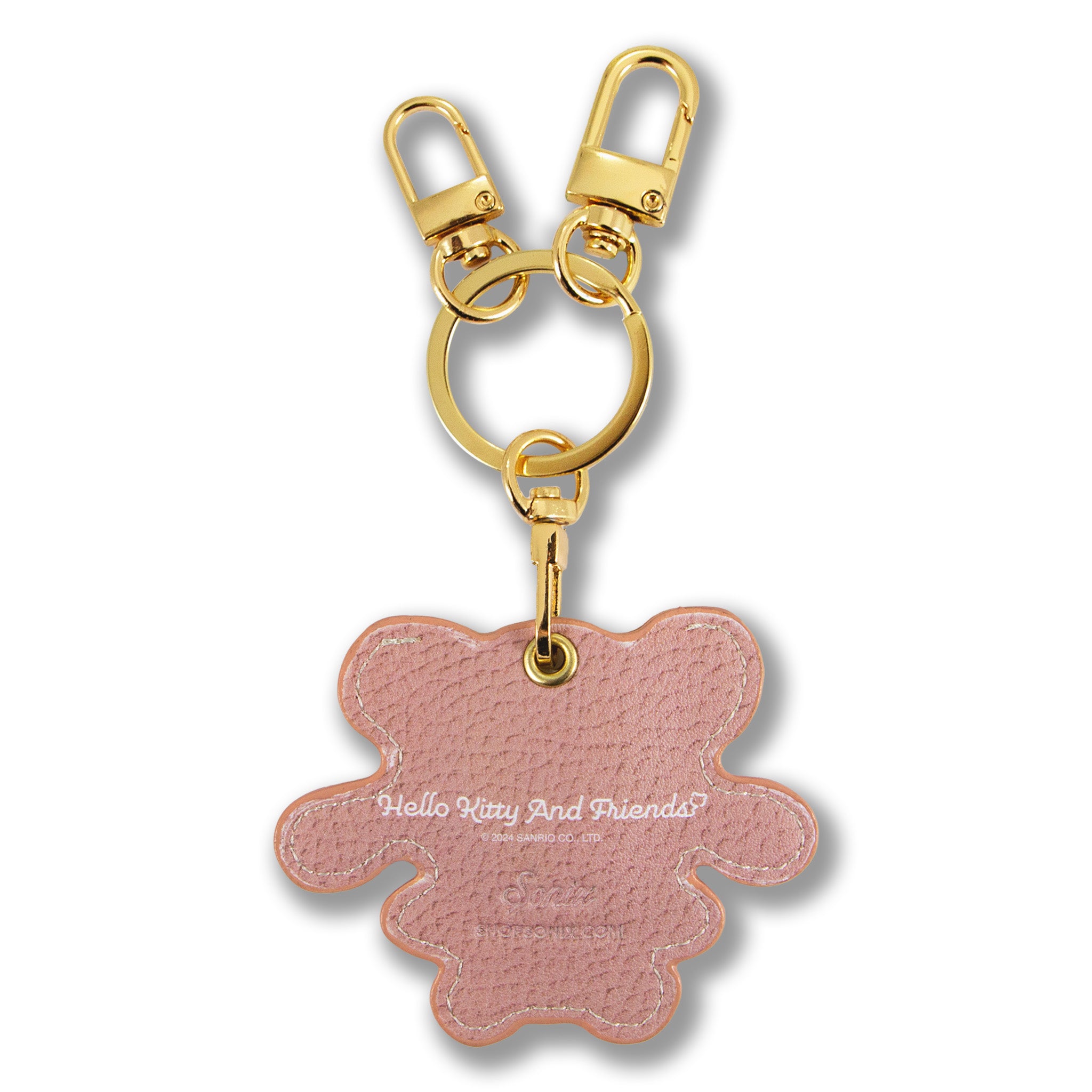 Latte-brown leather keychain with gold carabiner in use
