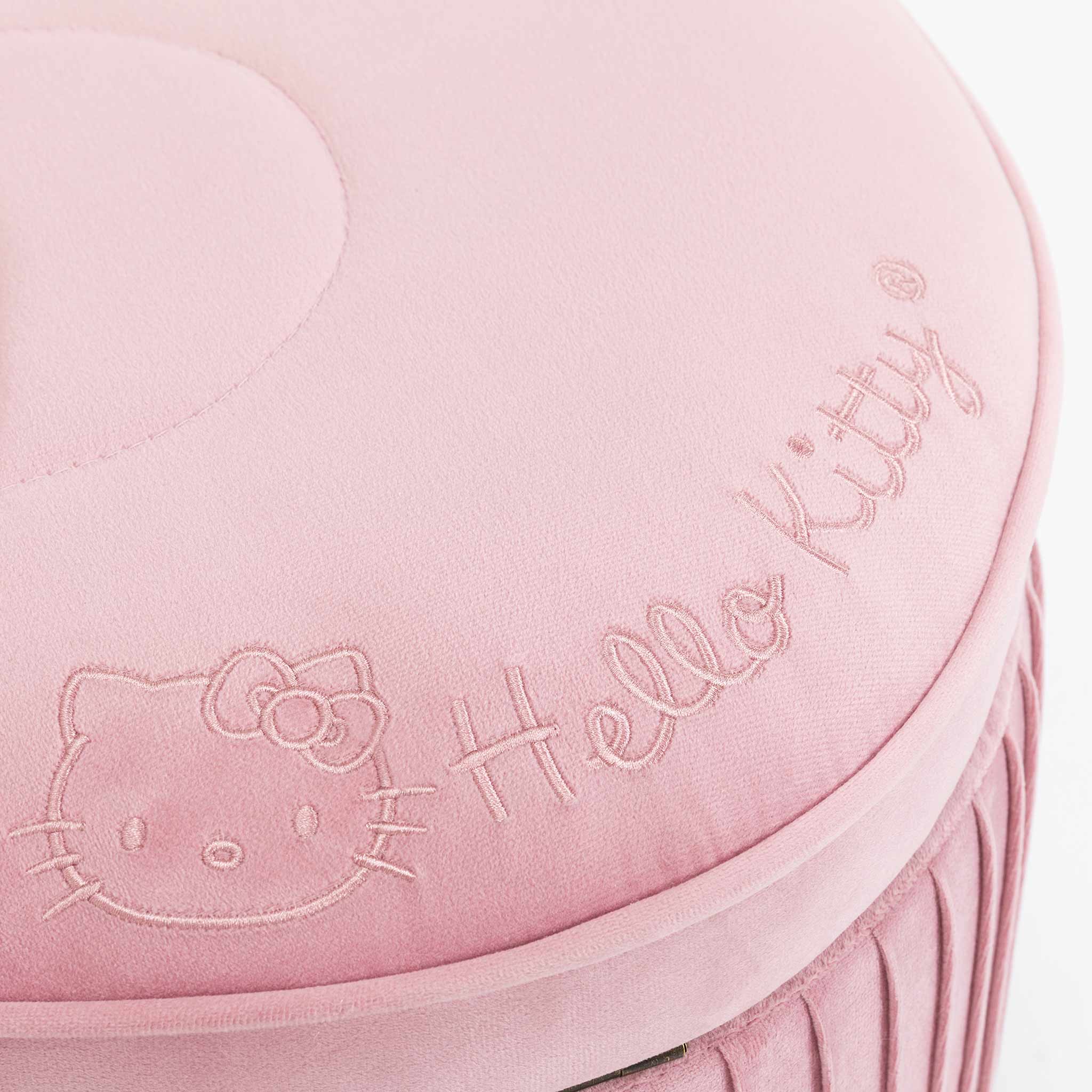 Close-up of pink velvet Hello Kitty storage bench with embroidered bow details