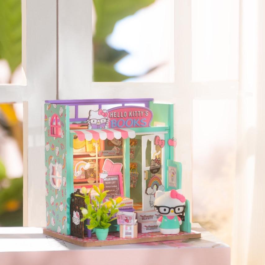 Detailed view of Hello Kitty figurine inside the miniature bookstore.