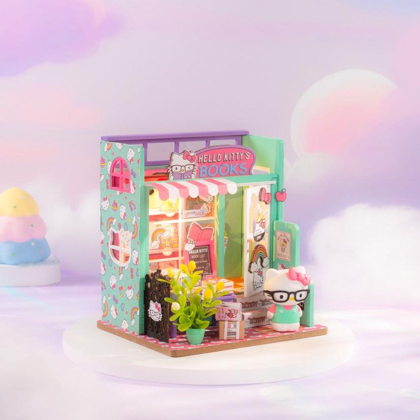 Assembled miniature bookstore showcasing cute signage and book list.
