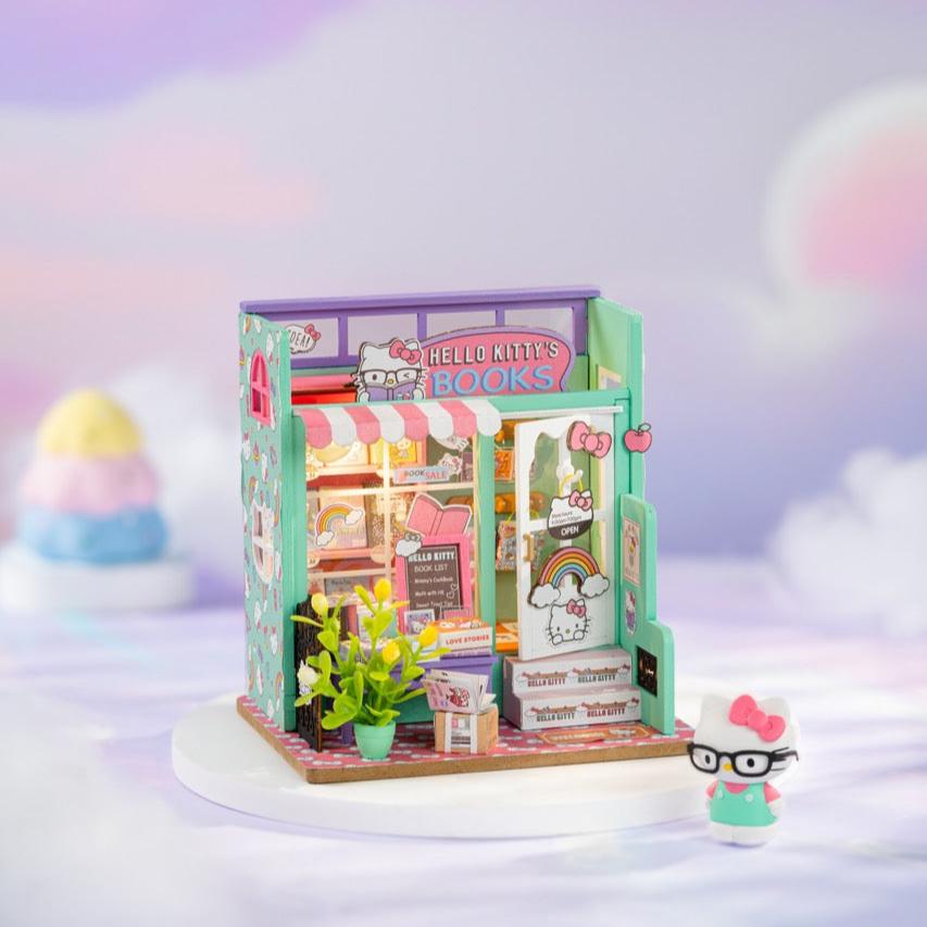 Detailed view of Hello Kitty figurine inside the miniature bookstore.