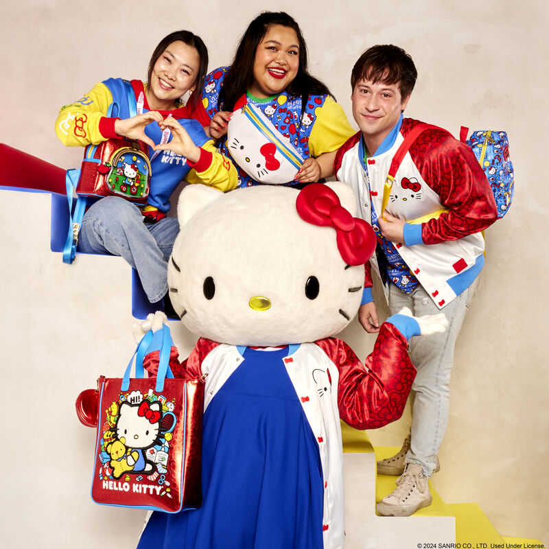 Hello Kitty Loungefly mini backpack side view, highlighting the adjustable red padded straps and front pocket.