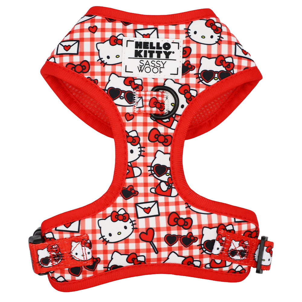 Hello Kitty red dog harness displayed on a white background, highlighting its classic red and gingham print.