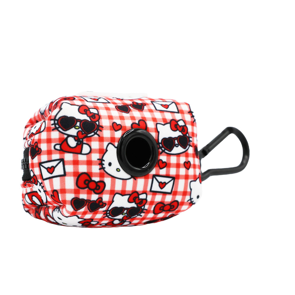 Hello Kitty pet waste bag holder clipped to a leash, ready for use during a walk.