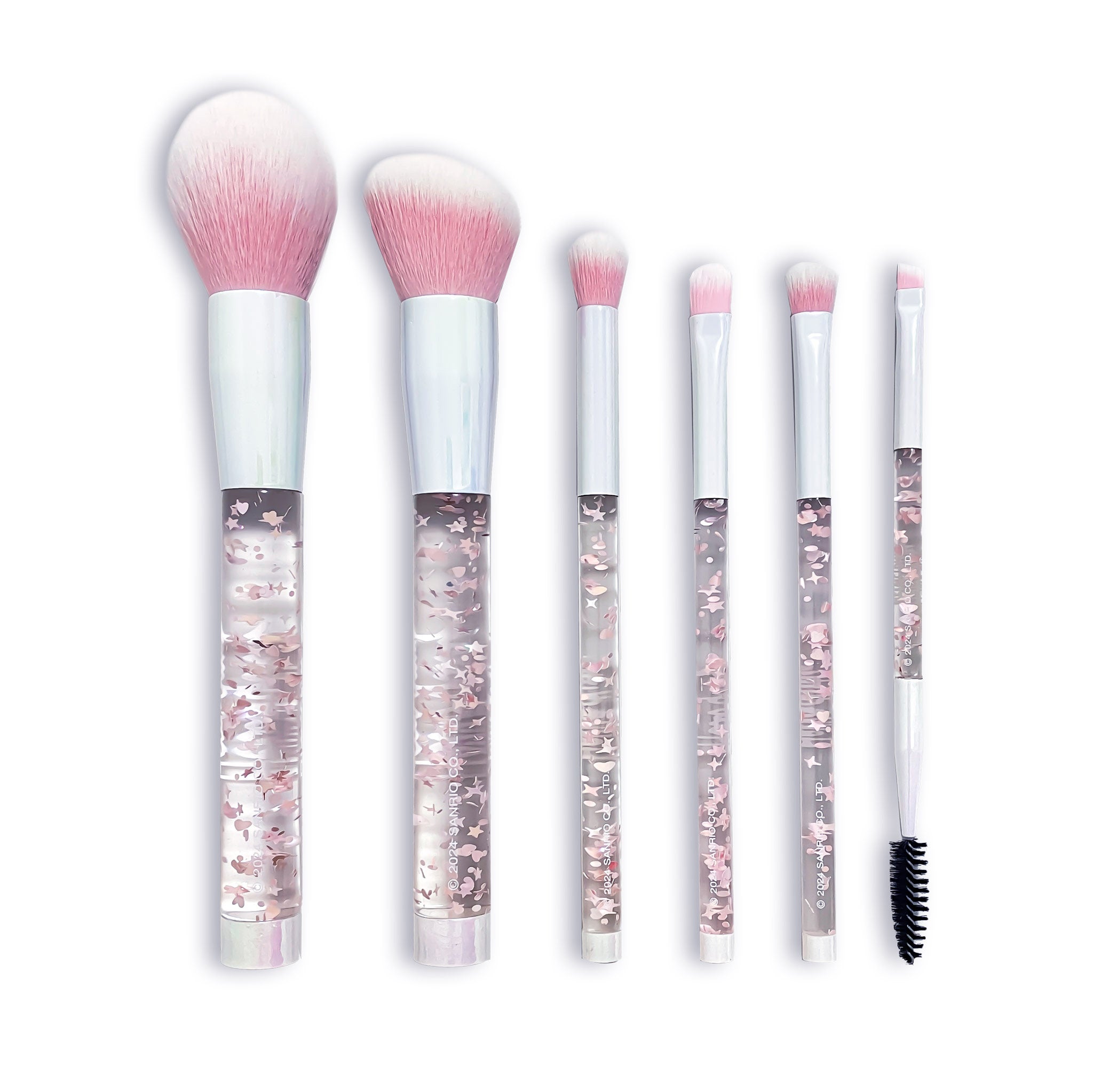 Close-up of Hello Kitty brush set with pink confetti handles and soft bristles.