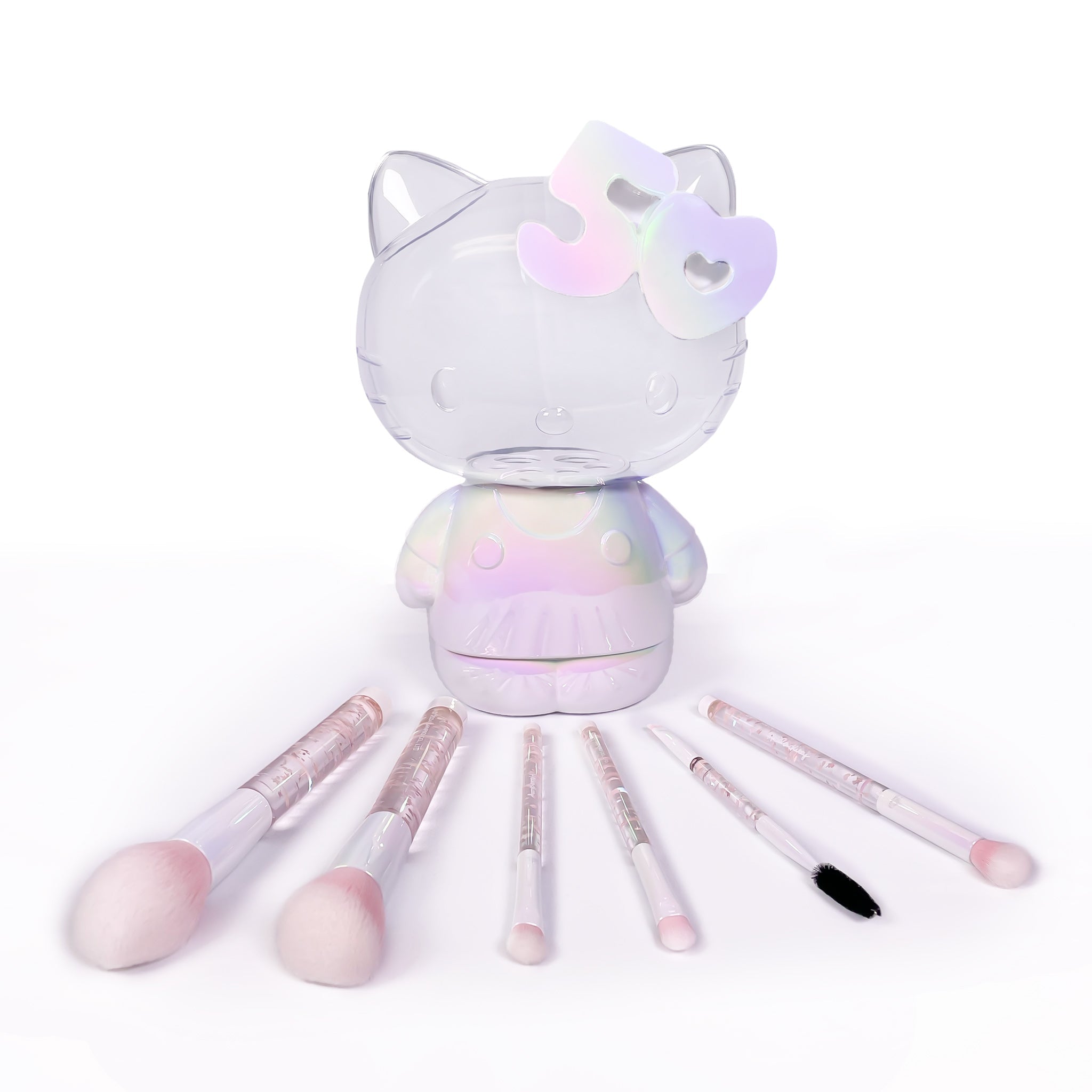 Close-up of Hello Kitty brush set with pink confetti handles and soft bristles.