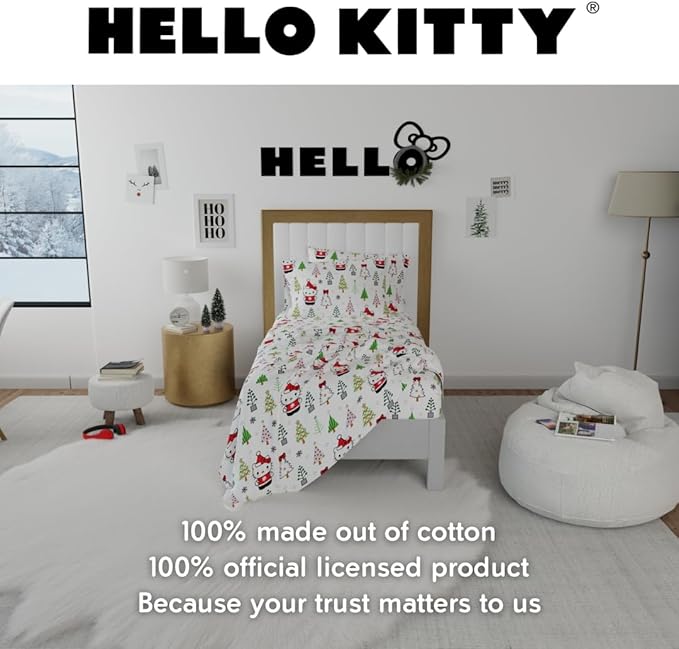 Close-up of Hello Kitty dressed as Santa on the flannel sheets with holiday decorations.