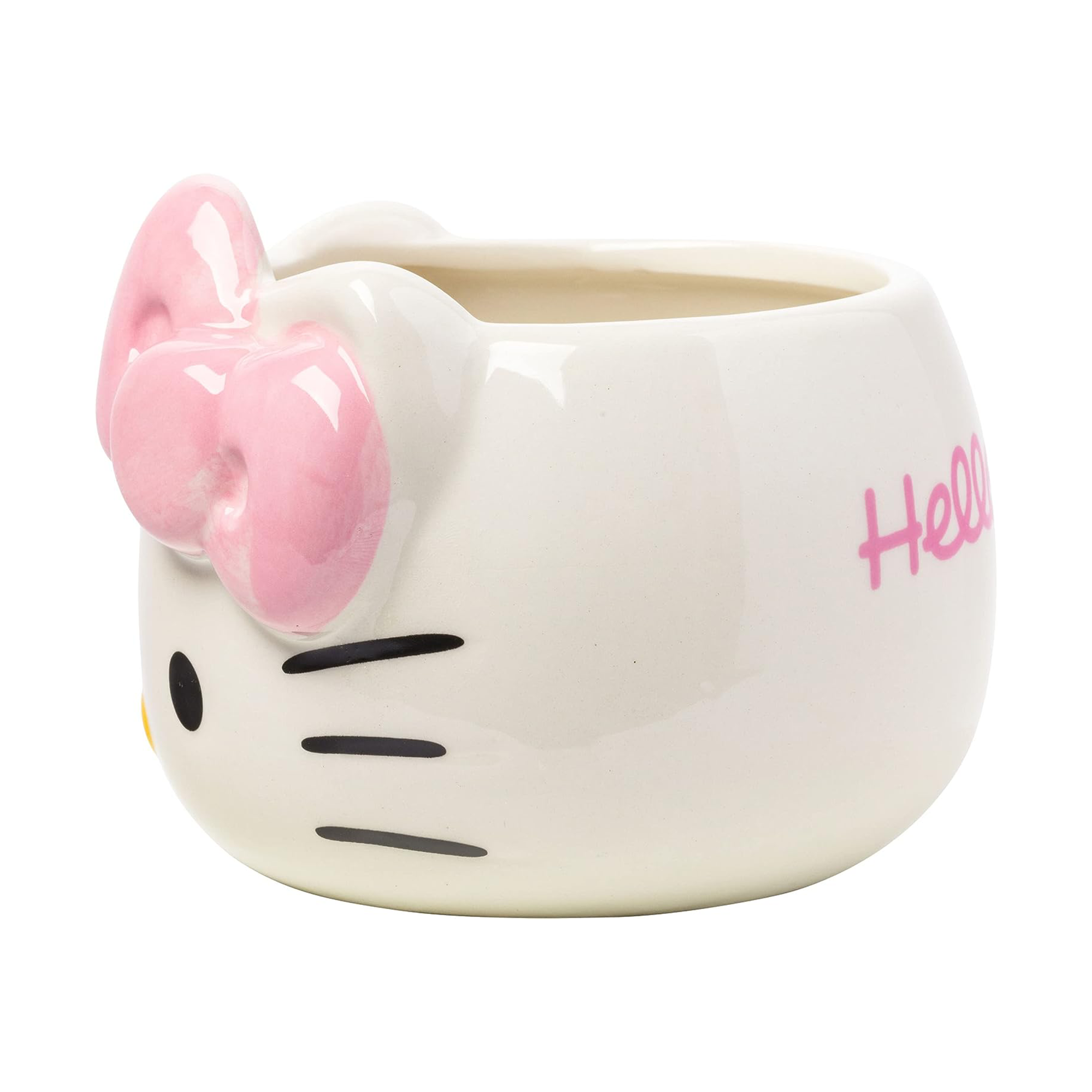 Hello Kitty mug on a wooden table with coffee inside