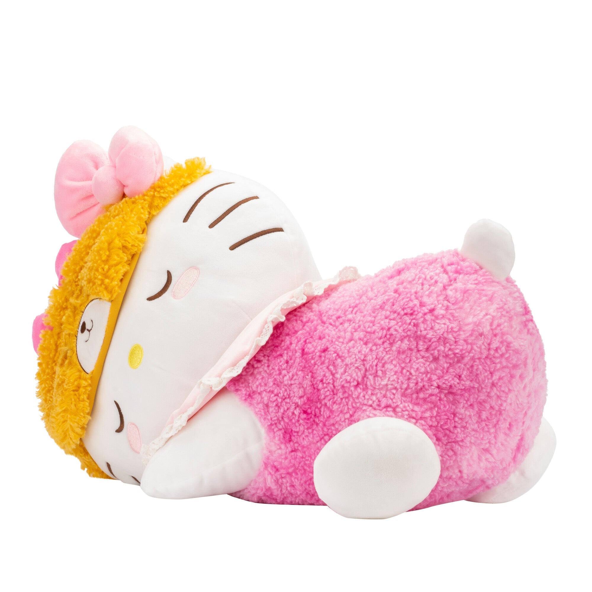 Giant Hello Kitty plush lying down, ready for a nap.