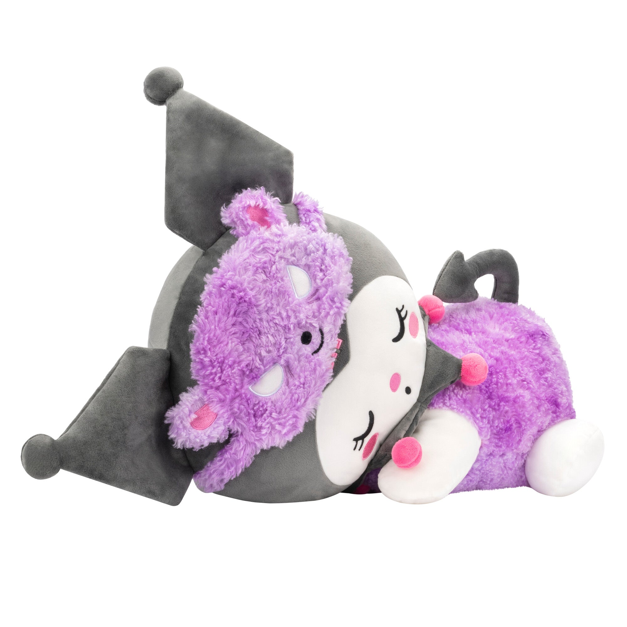 Kuromi plush doll lying down with Sherpa accents against a cozy bedroom backdrop