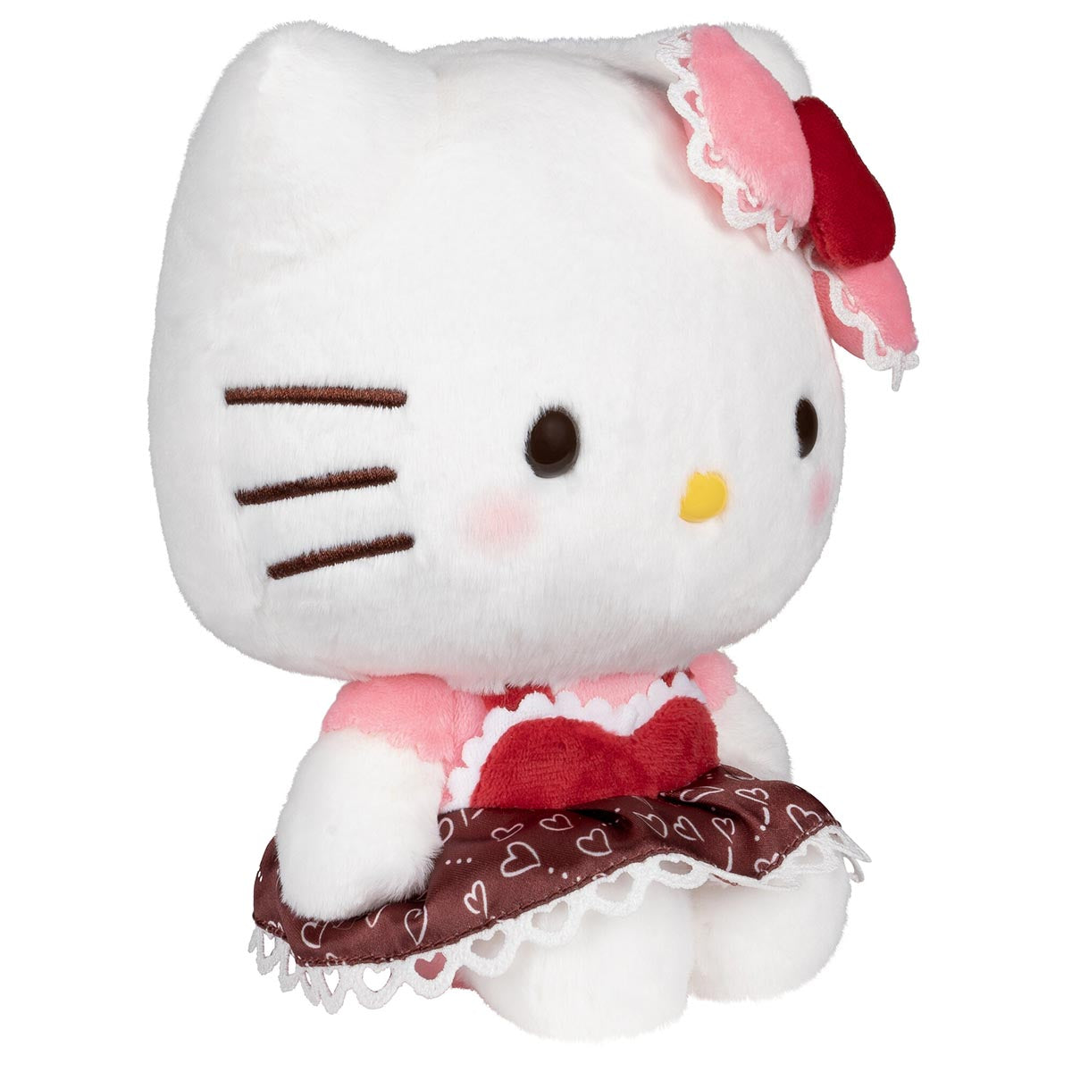 Front view of the big Hello Kitty plush sitting upright in her heart-print dress