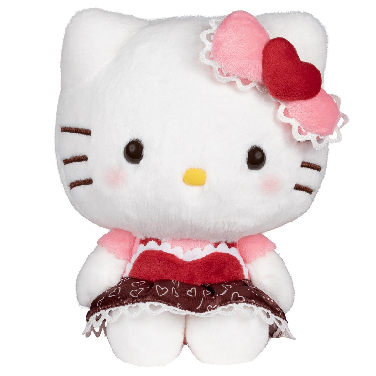 Front view of the big Hello Kitty plush sitting upright in her heart-print dress
