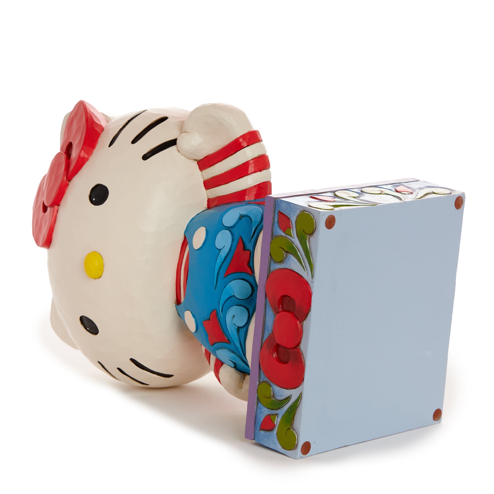 Hello Kitty figurine by Jim Shore, vibrant colors and intricate patterns.