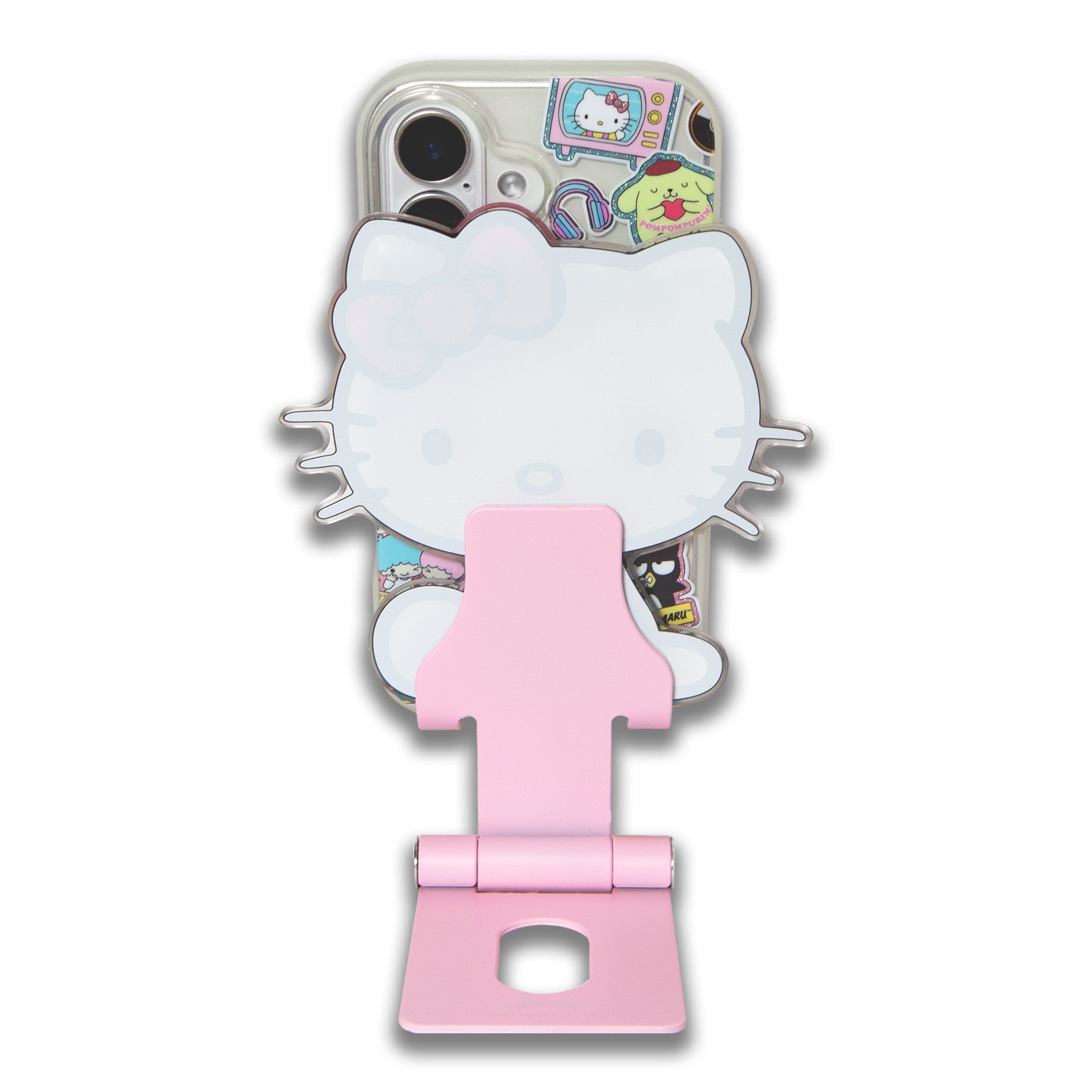 Hello Kitty standing proudly as a cute decor piece next to a laptop on a desk.