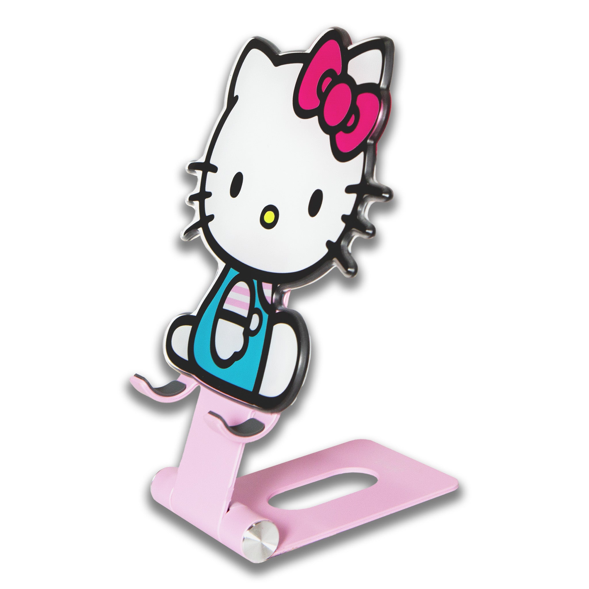 Hello Kitty standing proudly as a cute decor piece next to a laptop on a desk.