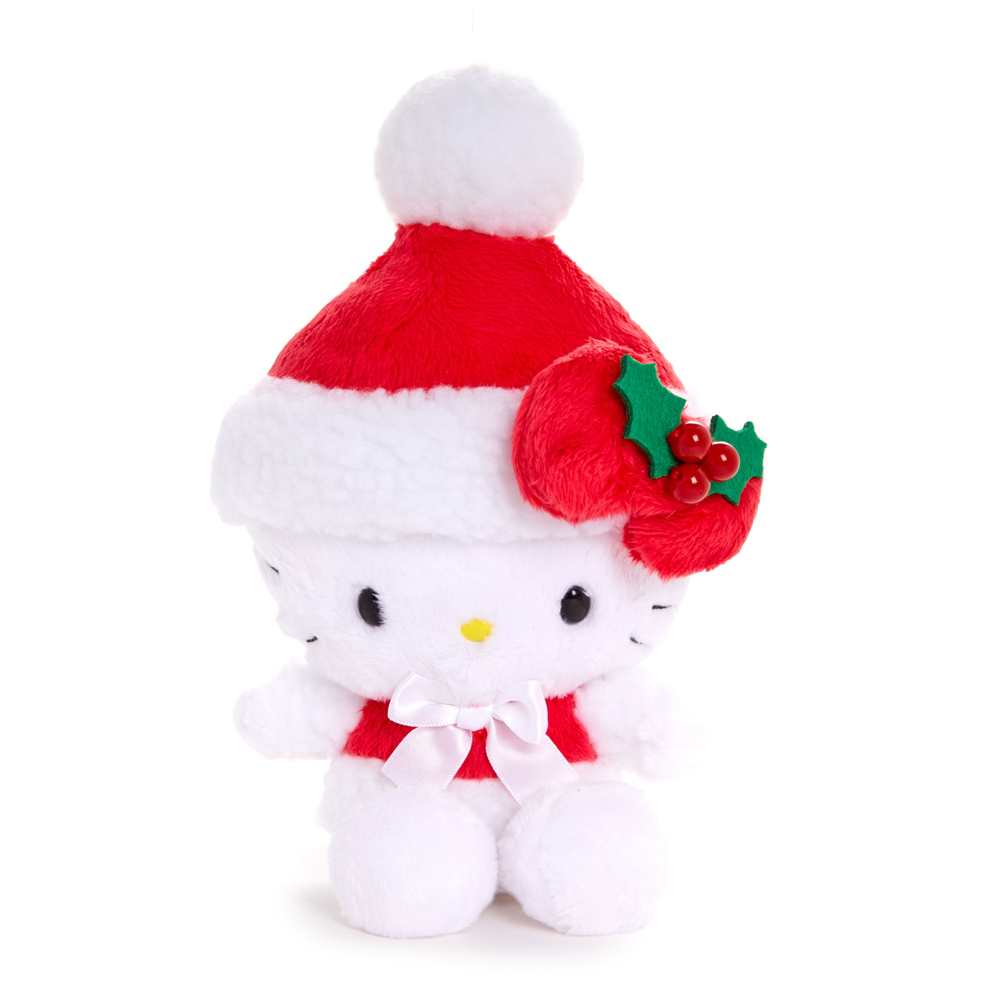 Hello Kitty Santa ornament hanging on a Christmas tree branch