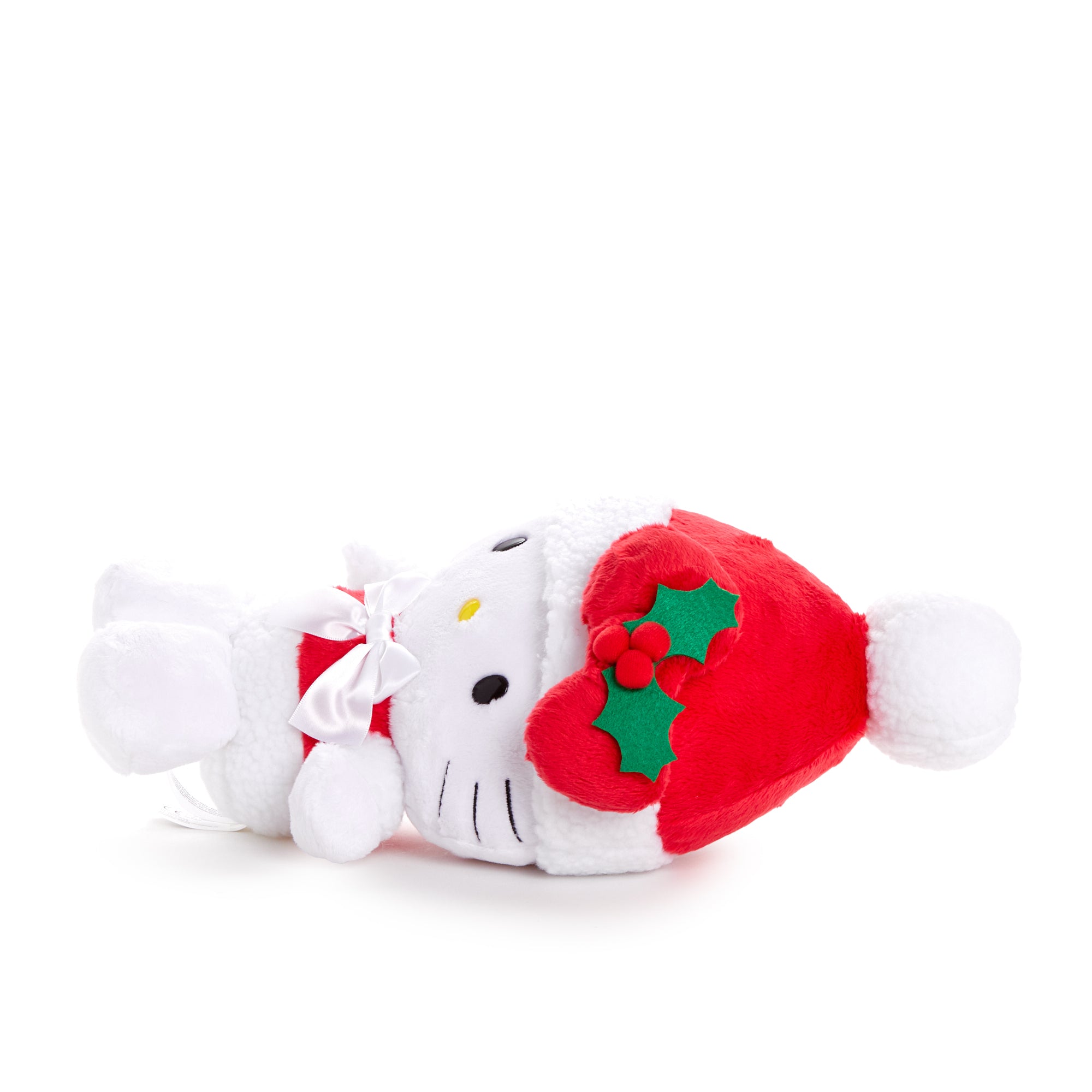 Hello Kitty Santa plush doll on a festive holiday table