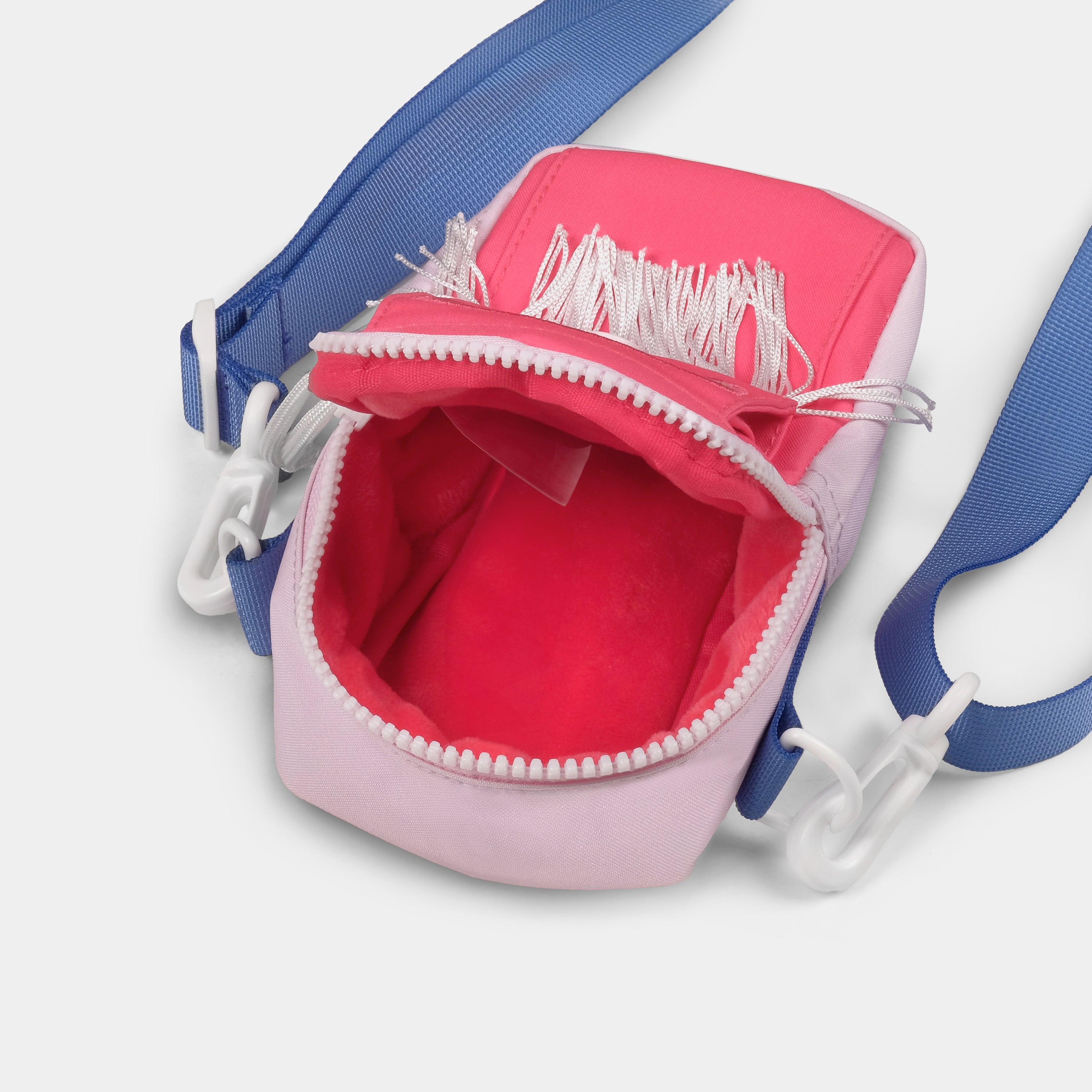 Close-up of the Hello Kitty Cowgirl camera bag’s fringe details and snap closure