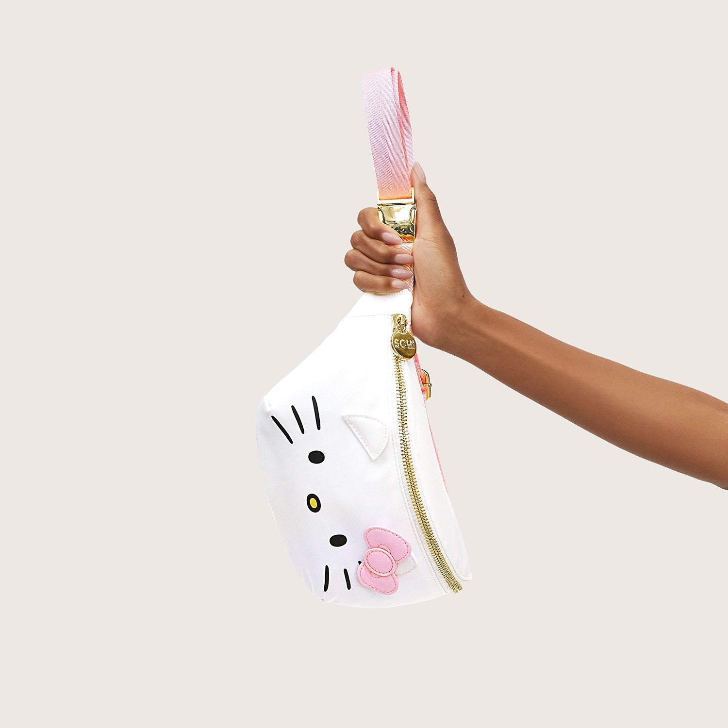 Hello Kitty fanny pack worn crossbody in a casual outfit.