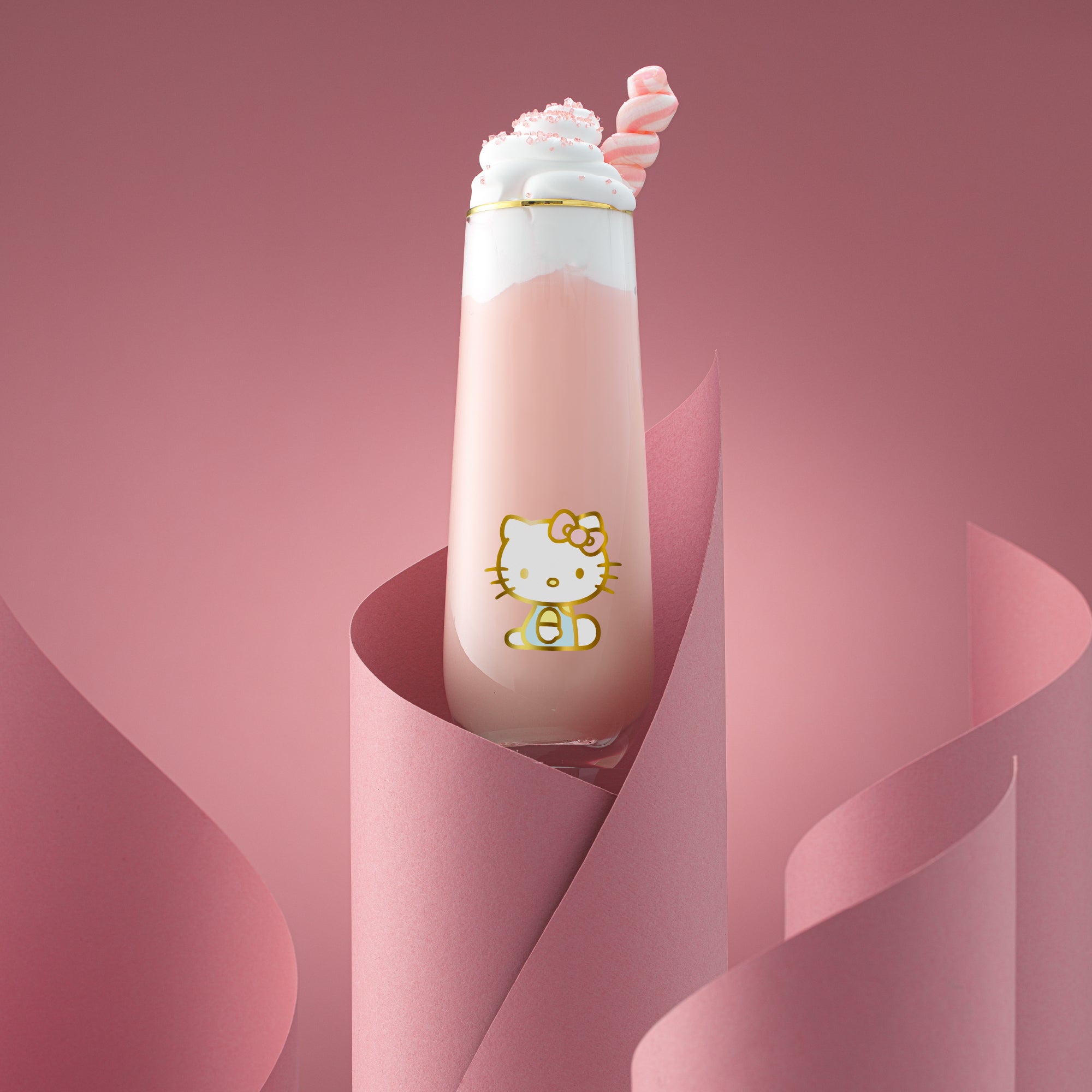 Close-up of Hello Kitty stemless flute with gold rim on a celebration table