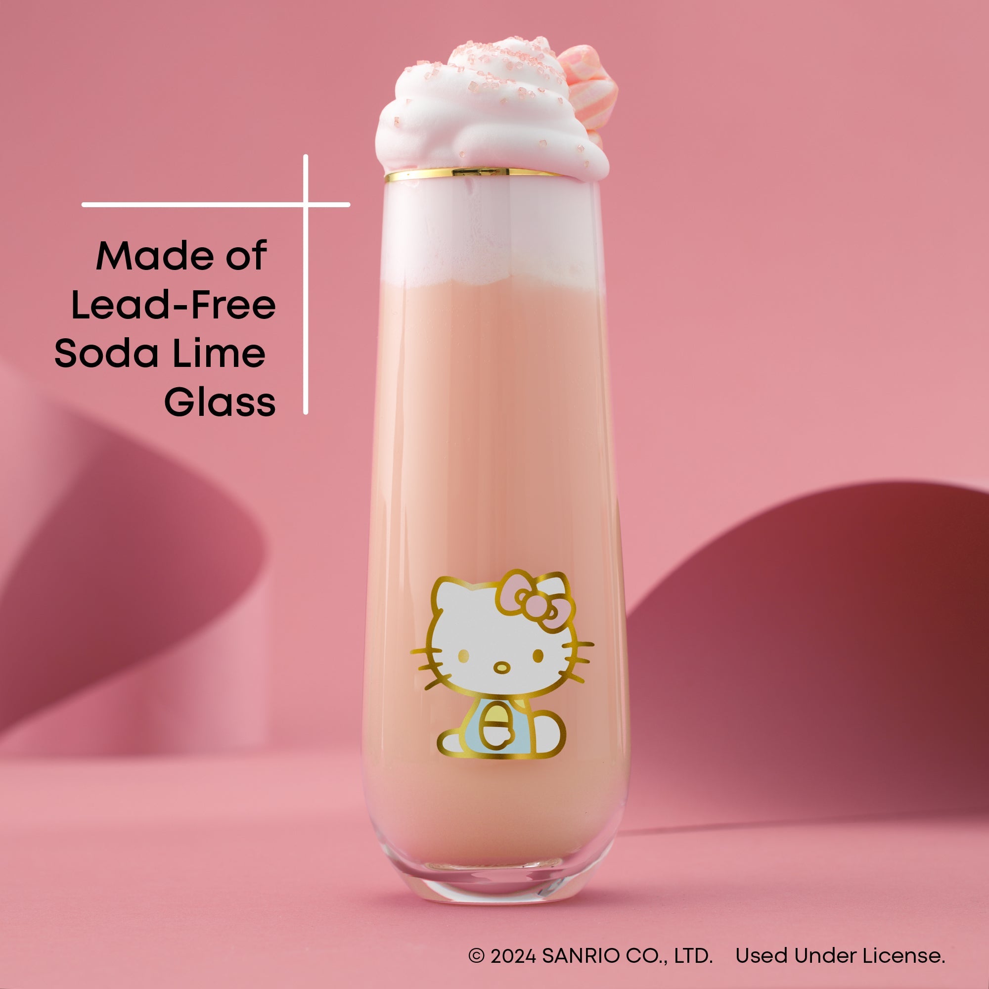 Close-up of Hello Kitty stemless flute with gold rim on a celebration table