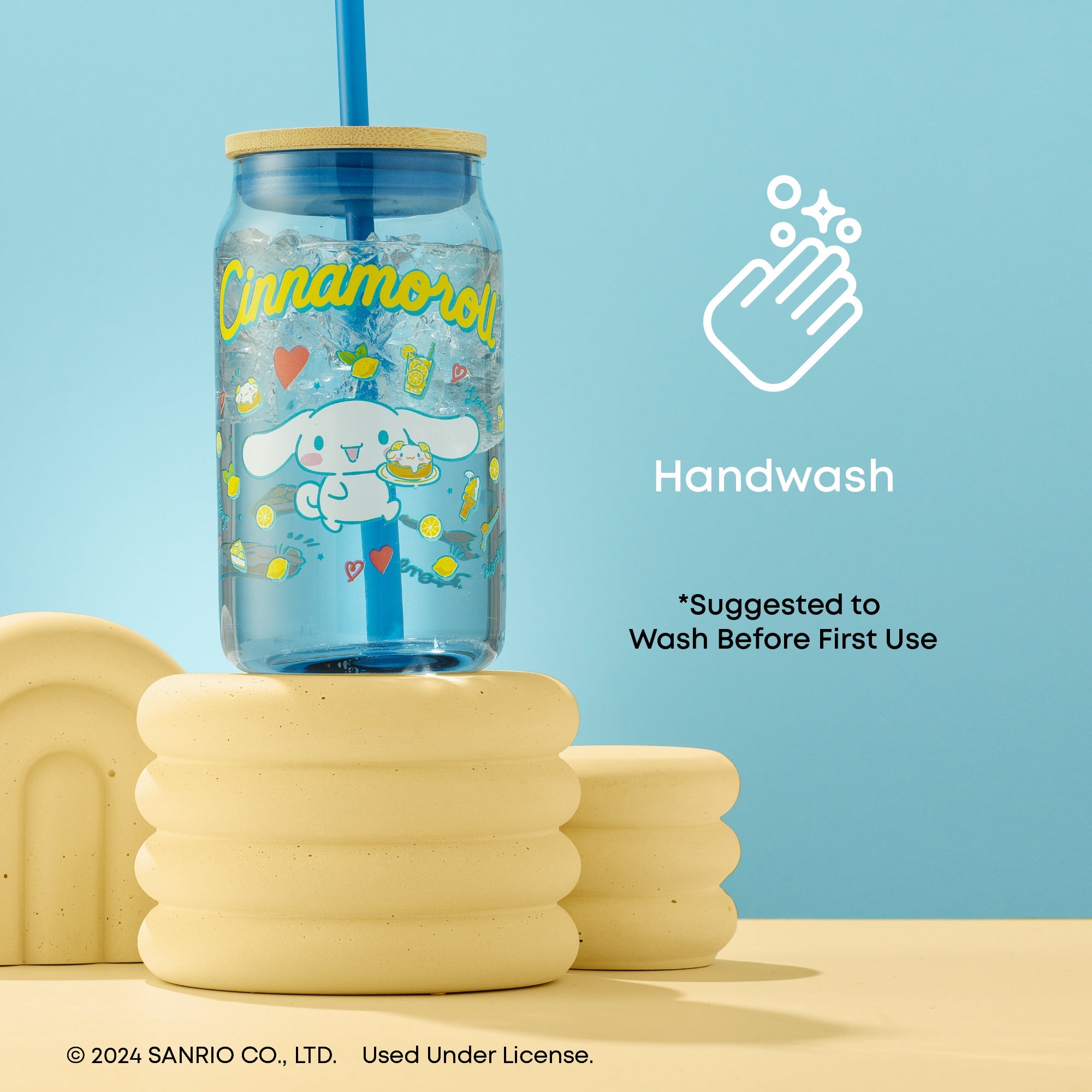 Cinnamoroll-themed glass tumbler being used for sipping tea, highlighting its cute design
