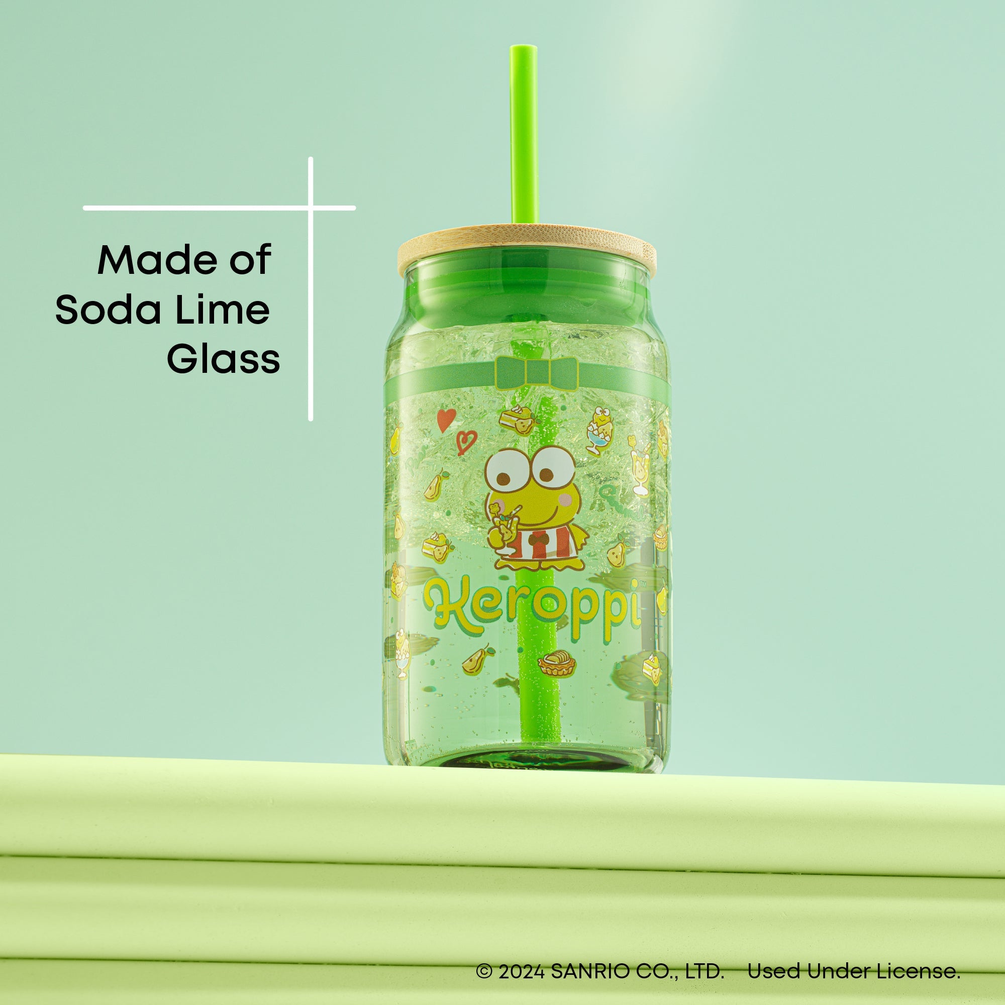 Keroppi glass tumbler with straw on a wooden table, showcasing its kawaii design