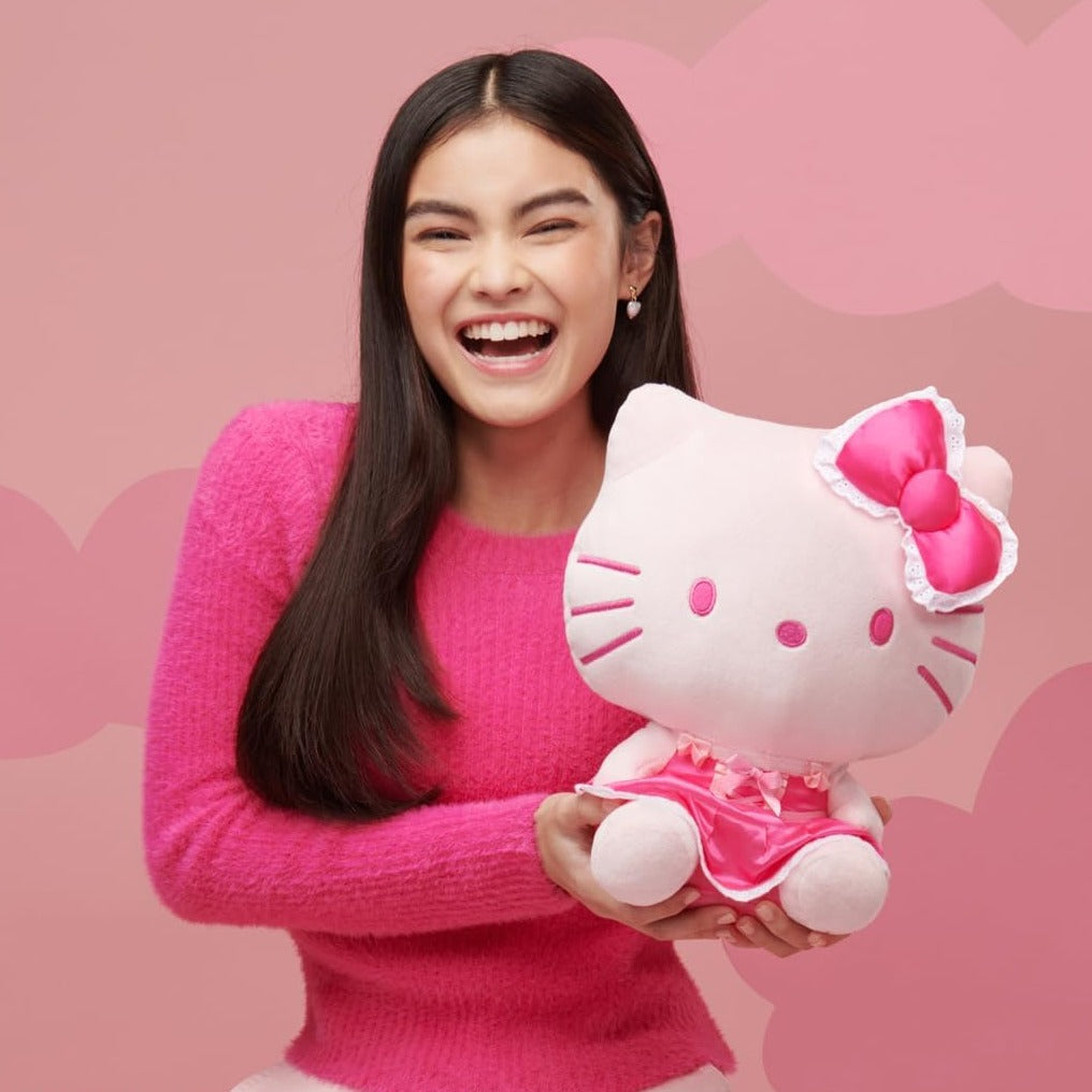 Detailed look at the embroidered features of the Hello Kitty plush backpack.