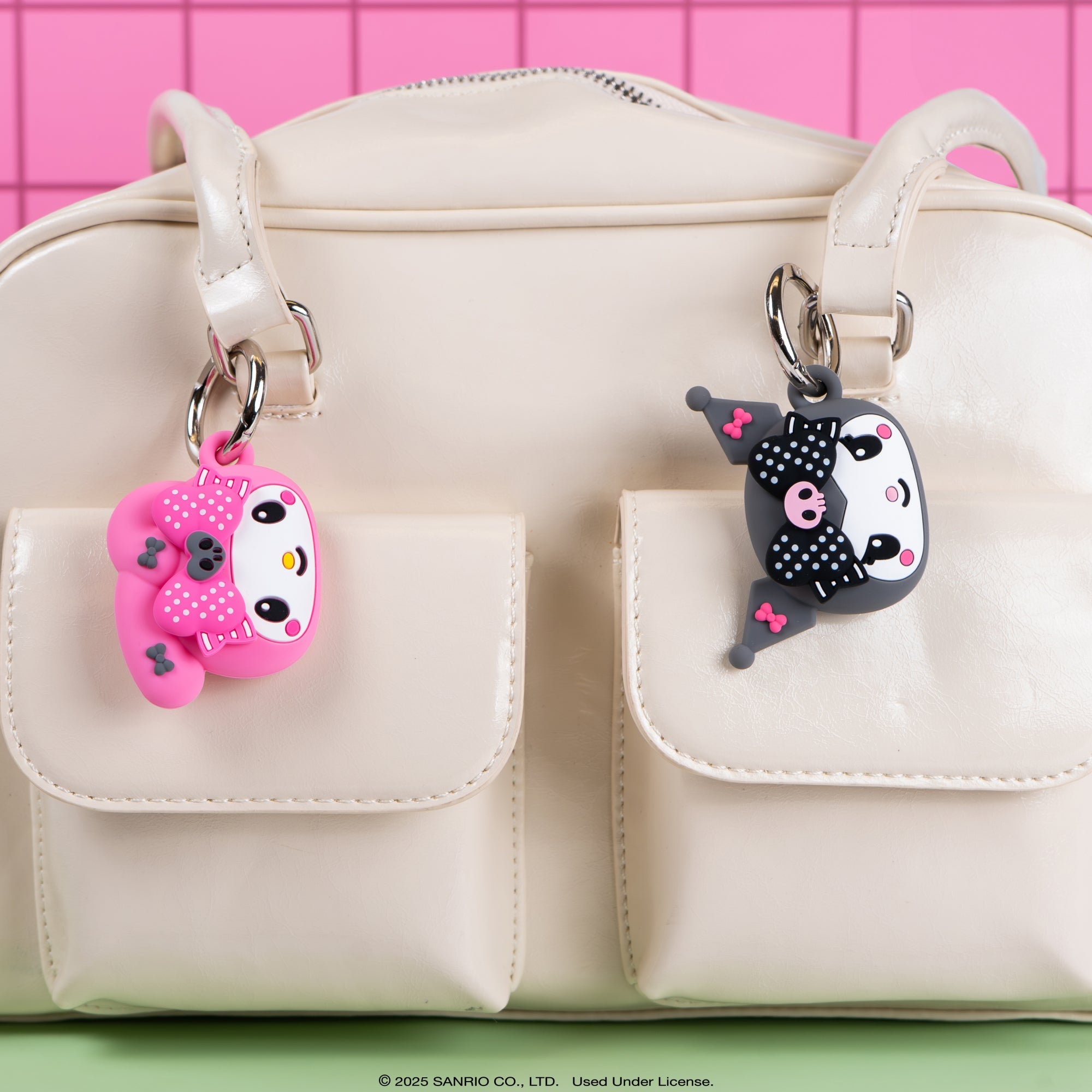 Kuromi AirTag case in hand, showcasing 3D figural design and silicone material.