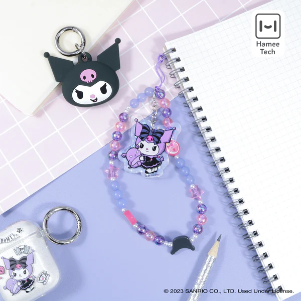 Close-up of the iridescent keychain featuring Kuromi and Baku