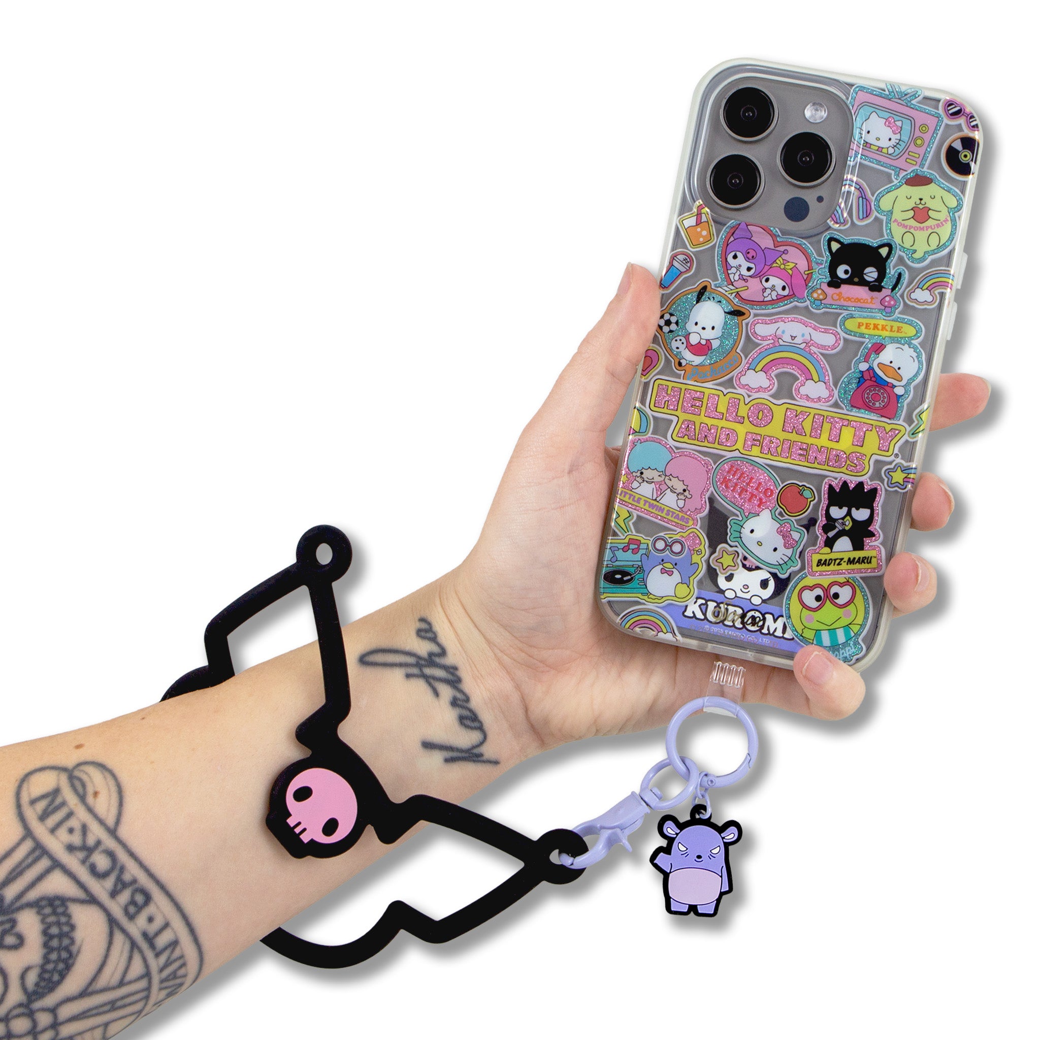 Kuromi phone wristlet worn on wrist during outdoor activity